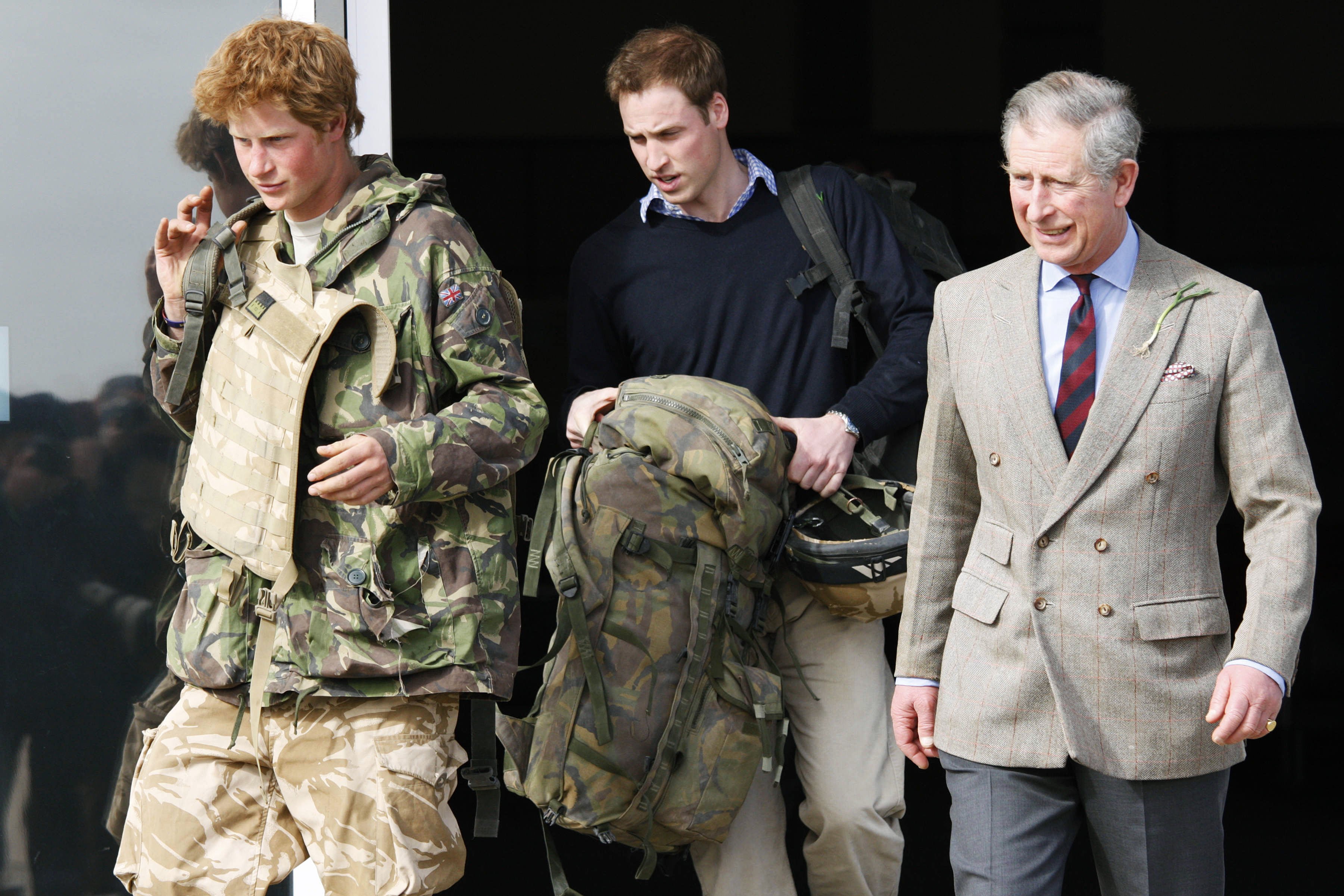 Prince Harry, Prince Charles, and Prince William as Harry returns to Britain at Royal Air Force RAF Brize Norton airbase after active service in Afghanistan on March 1, 2008, in Oxfordshire, England | Source: Getty Images