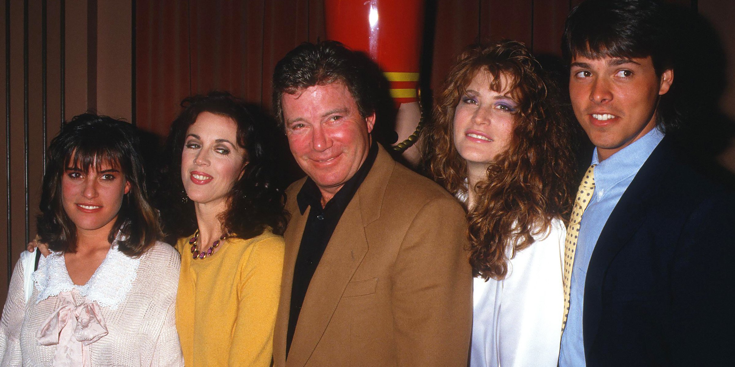 William Shatner, Marcy Lafferty, His Two Daughters, and a Guest, 1987 | William Shatner and His Granddaughter, Willow, 2006 | Source: Getty Images