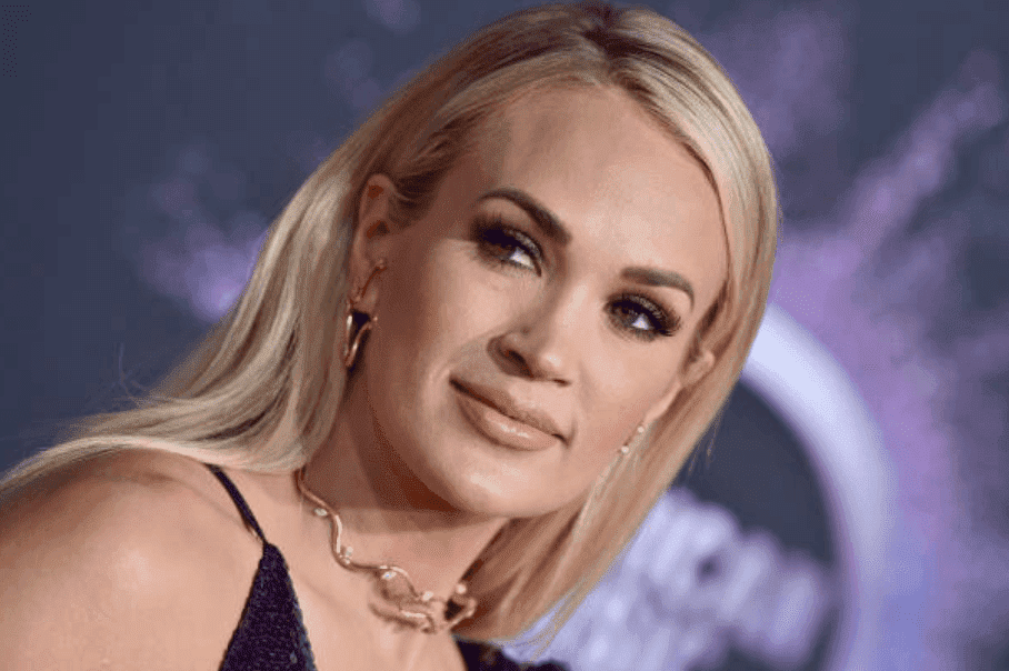 Carrie Underwood glows in a purple dress on the red carpet at the 2019 American Music Awards, on November 24, 2019 in Los Angeles, California | Source: Getty Images (Photo by Axelle/Bauer-Griffin/FilmMagic )