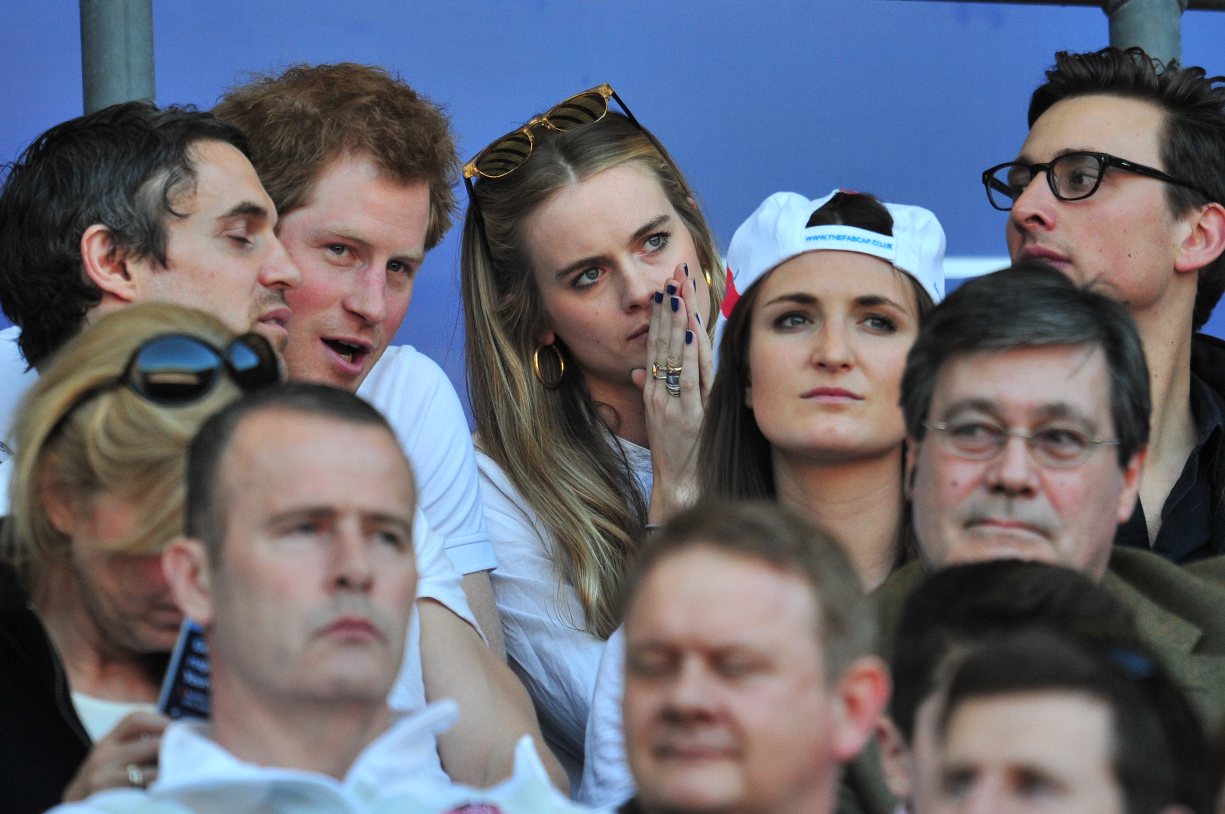 Prince Harry and Cressida Bonas watch the match during the Six Nations International rugby Union match at Twickenham on March 9, 2014 in London. | Source: Getty Images