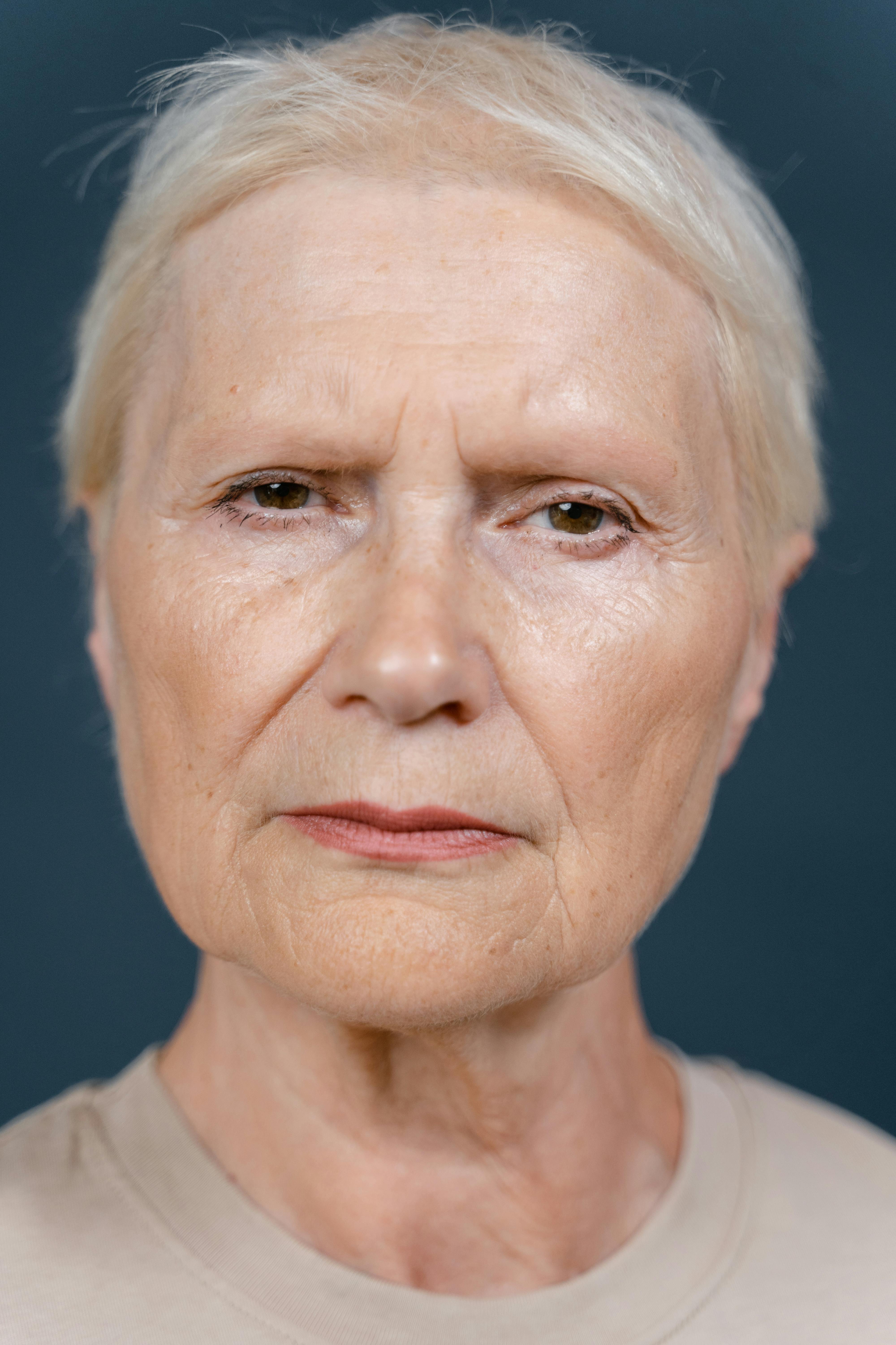 A smug-looking older woman | Source: Pexels