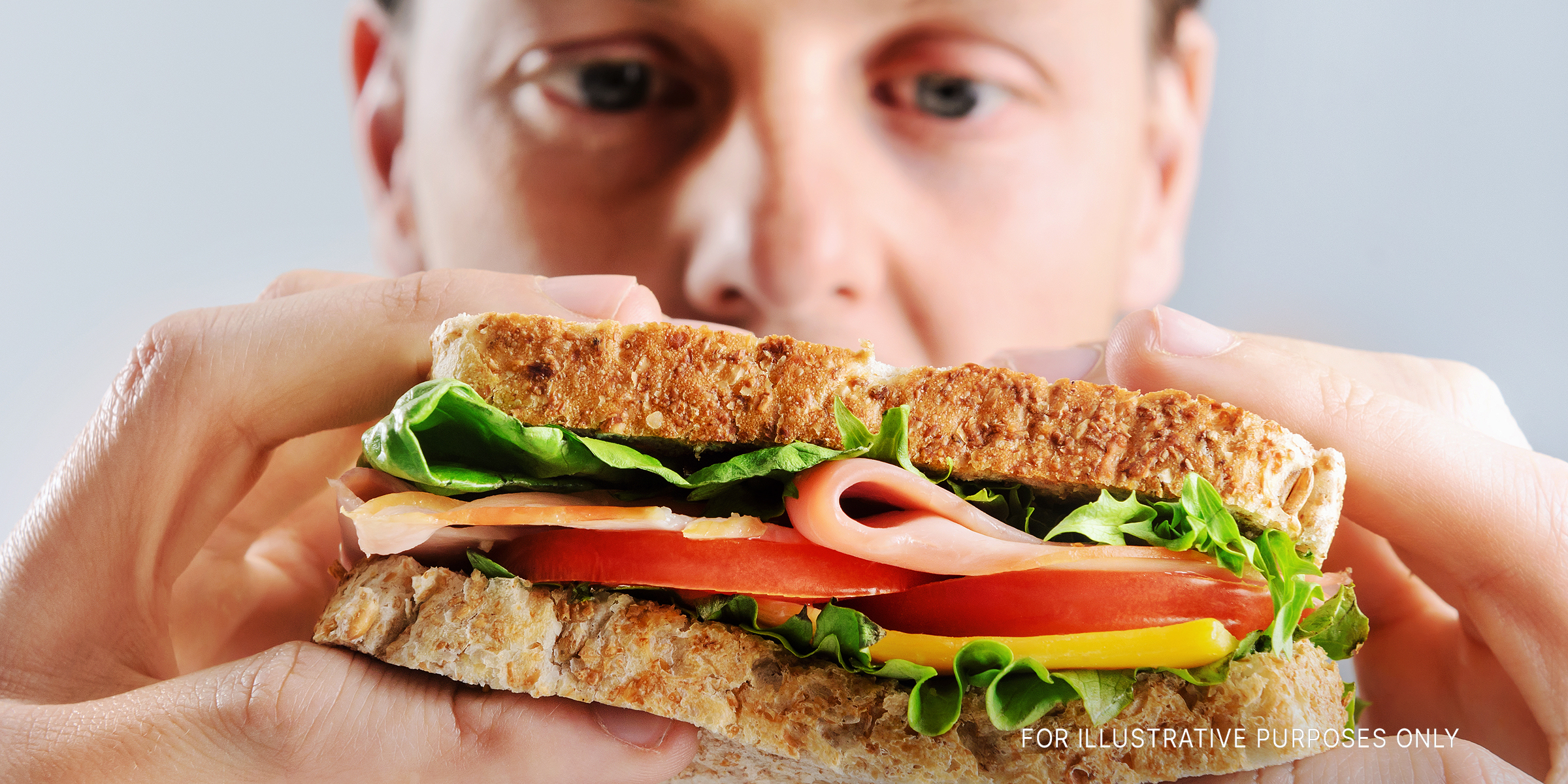 A man looking at a sandwich | Source: Shutterstock
