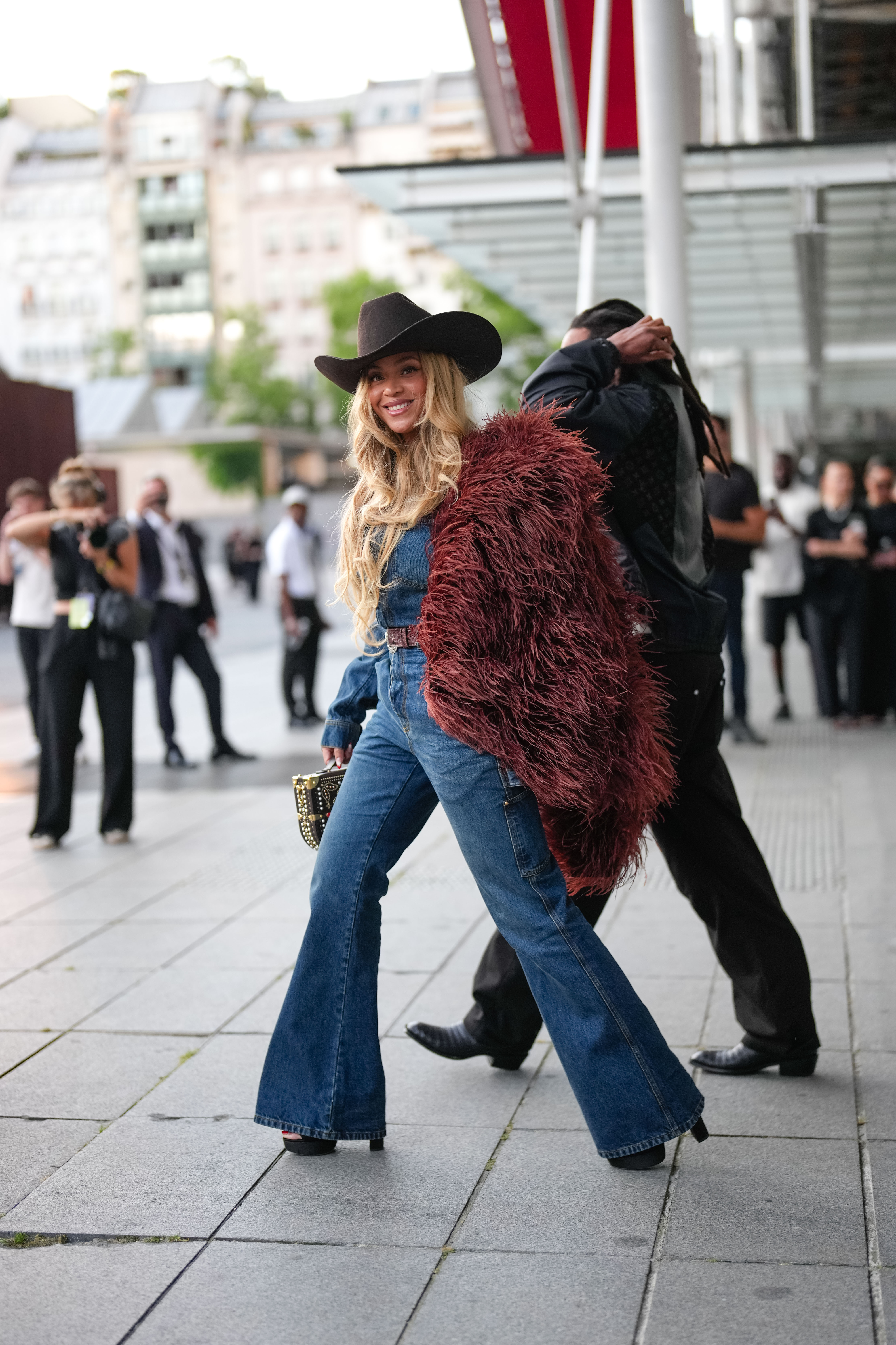 Beyoncé wears a cowboy hat and denim look at the Louis Vuitton Menswear Spring/Summer show during Paris Fashion Week in Paris on June 24, 2025. | Source: Getty Images