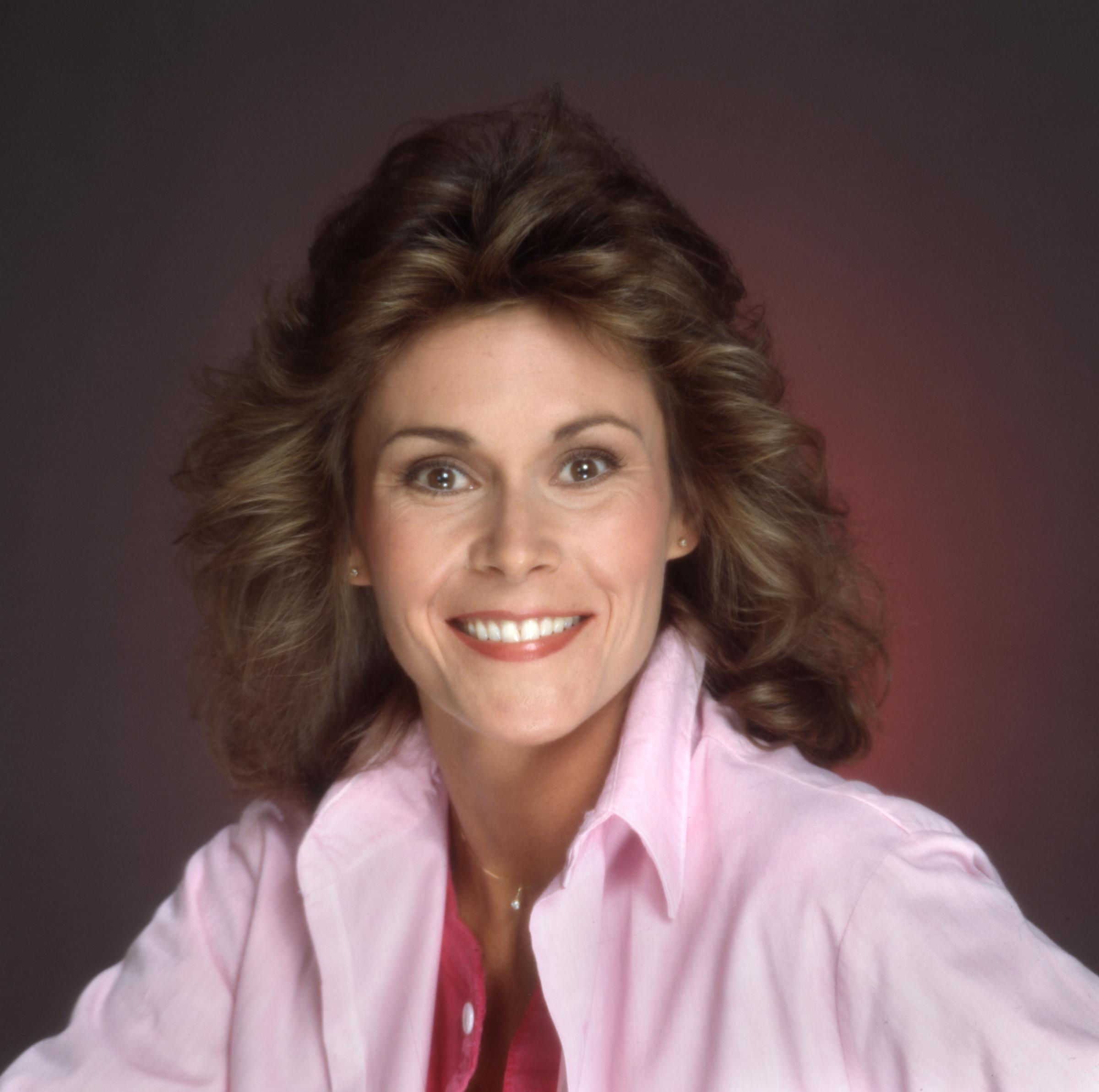Kate Jackson beams in a June 1, 1983 studio portrait, her bright eyes and signature feathered hairstyle reflecting the effortless charm that defined her television stardom.