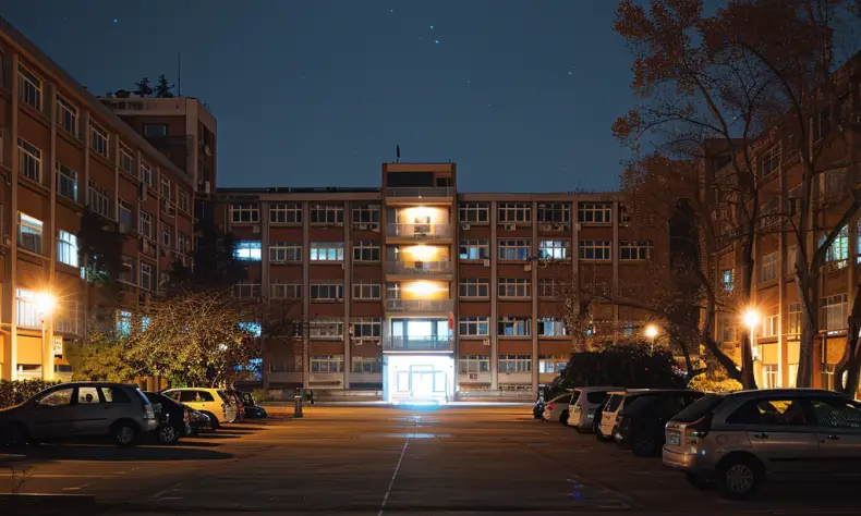 The exterior of a hospital building at night | Source: Midjourney