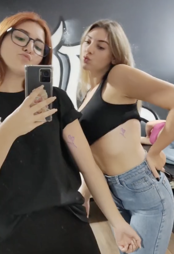 Guada Kelly's great-granddaughters posing with their tattoos in a TikTok video in 2023 | Source: tiktok.com/@guada.kelly