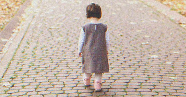 A little girl walking down the street | Source: Shutterstock