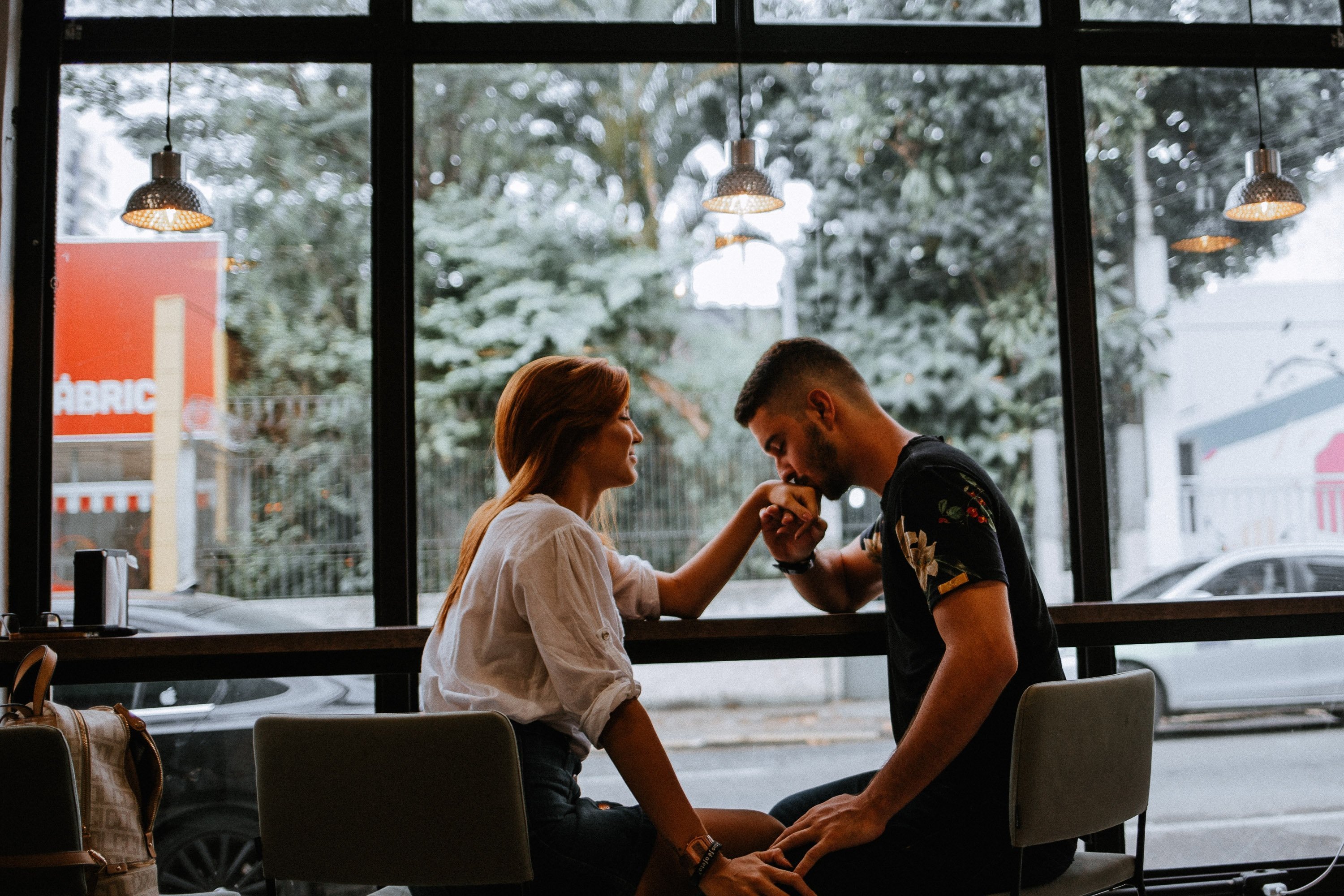 A man kissing a woman's hand. | Source: Unsplash