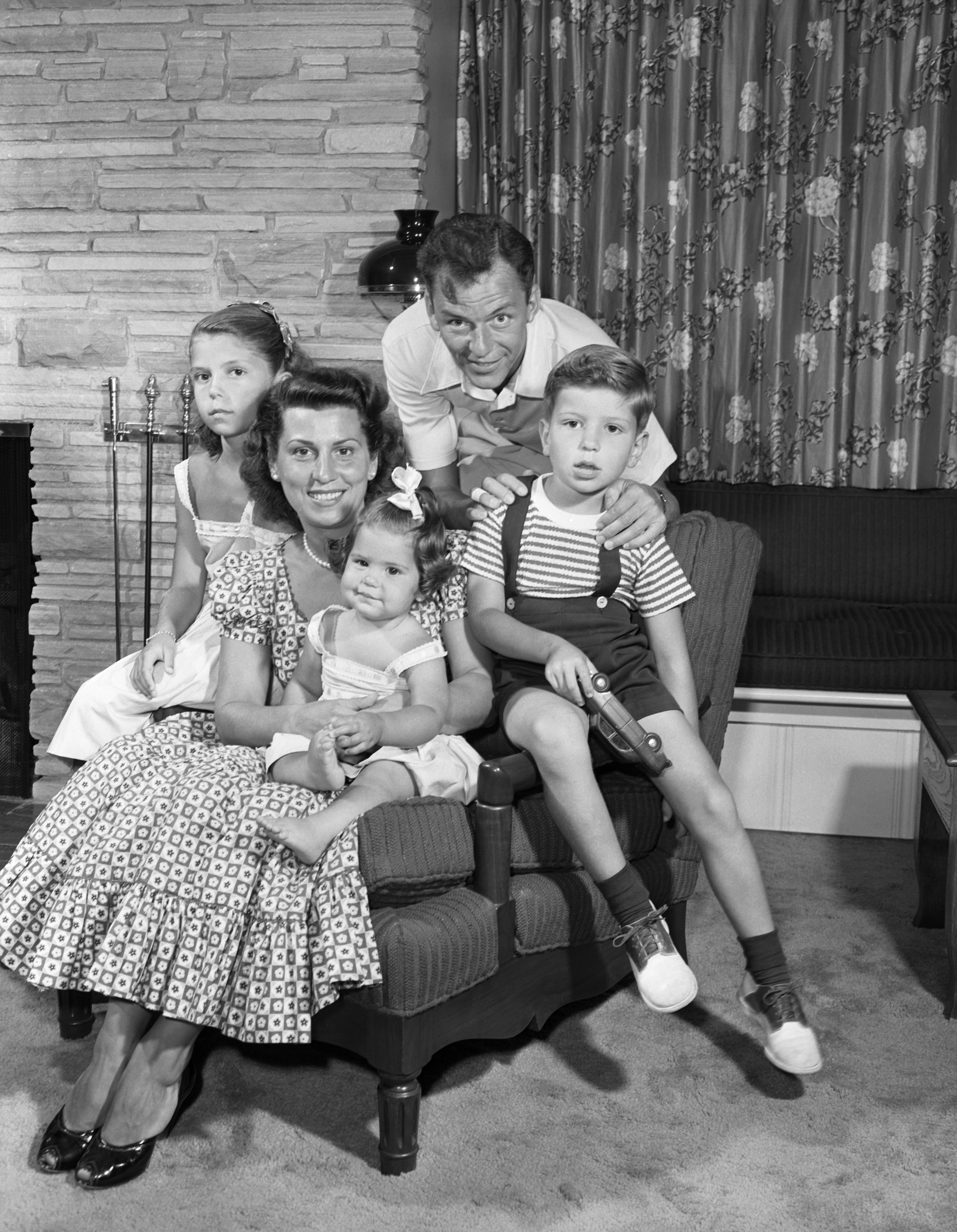 FranFrank Sinatra, son Frank Sinatra Jr., daughter Tina Sinatra, wife Nancy Barbato, daughter Nancy Sinatra in July 1949 | Source: Getty Images