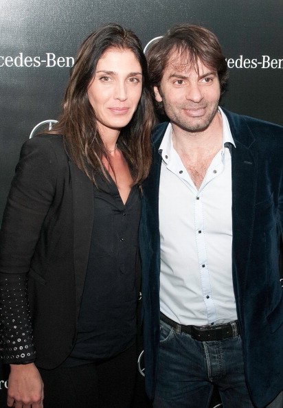 Loretta Dominici et le joueur de rugby Christophe Dominici, le 11 mars 2014 à Paris, France. | Photo : Getty Images
