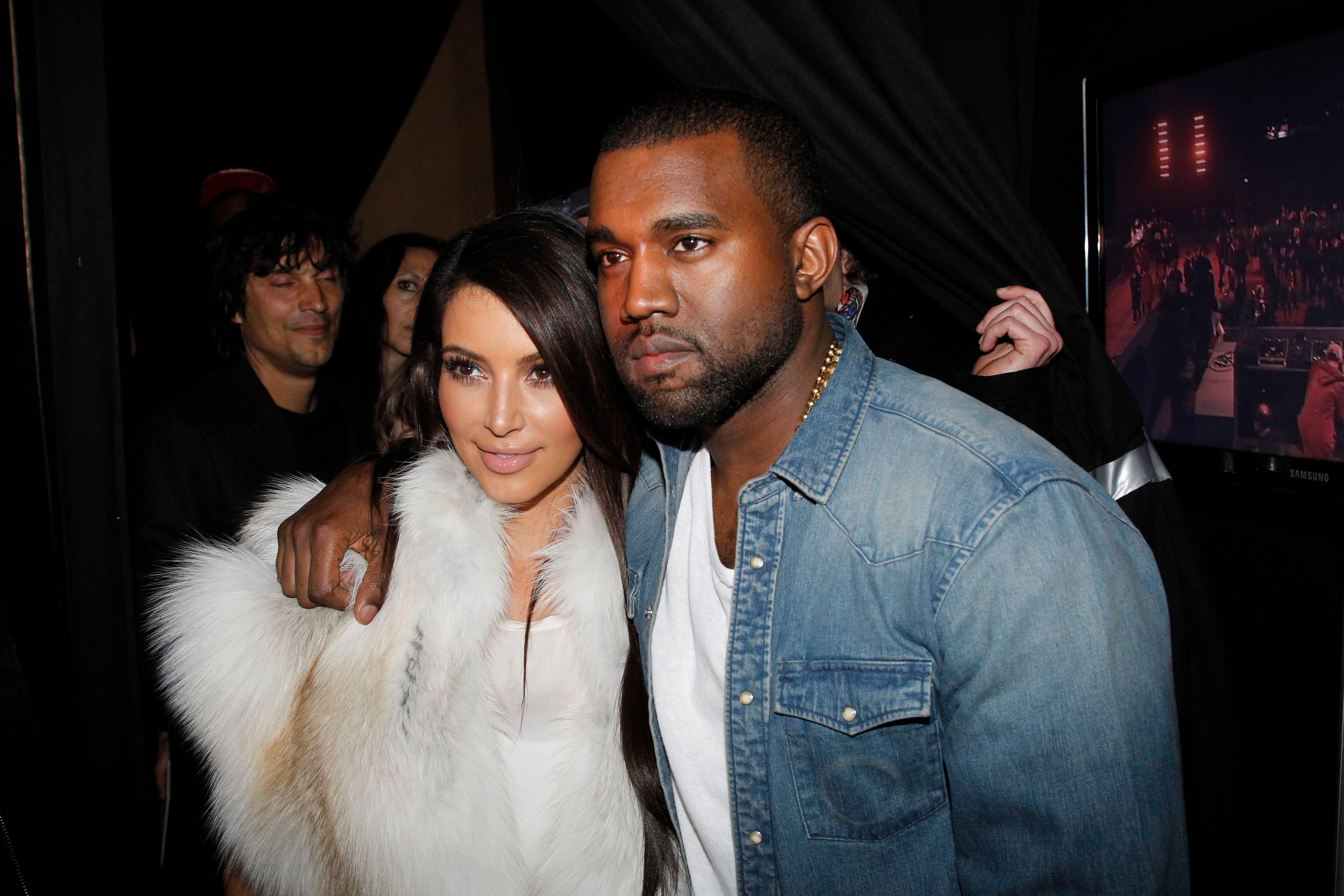 Kim Kardashian and Kanye West at the Kanye West Ready-To-Wear Fall/Winter show as part of Paris Fashion Week on March 6, 2012, in Paris, France | Photo: Getty Images