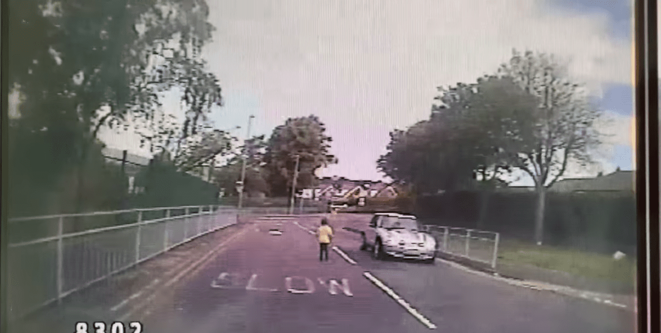 Screenshot of video showing boy running down the road. | Photo: Facebook / Rachael Heslop