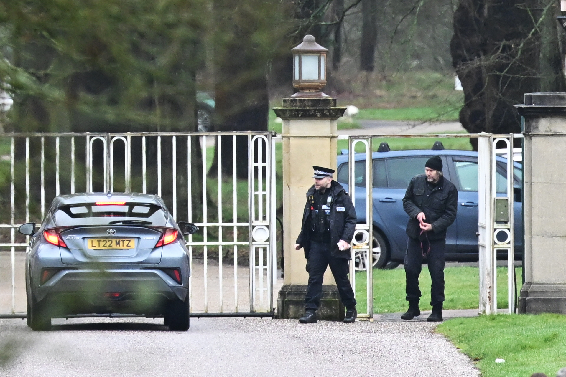 Police officers are stationed outside the gates of the Royal Lodge, Andrew Mountbatten-Windsor's former residence on February 19, 2026 in Windsor, England | Source: Getty Images