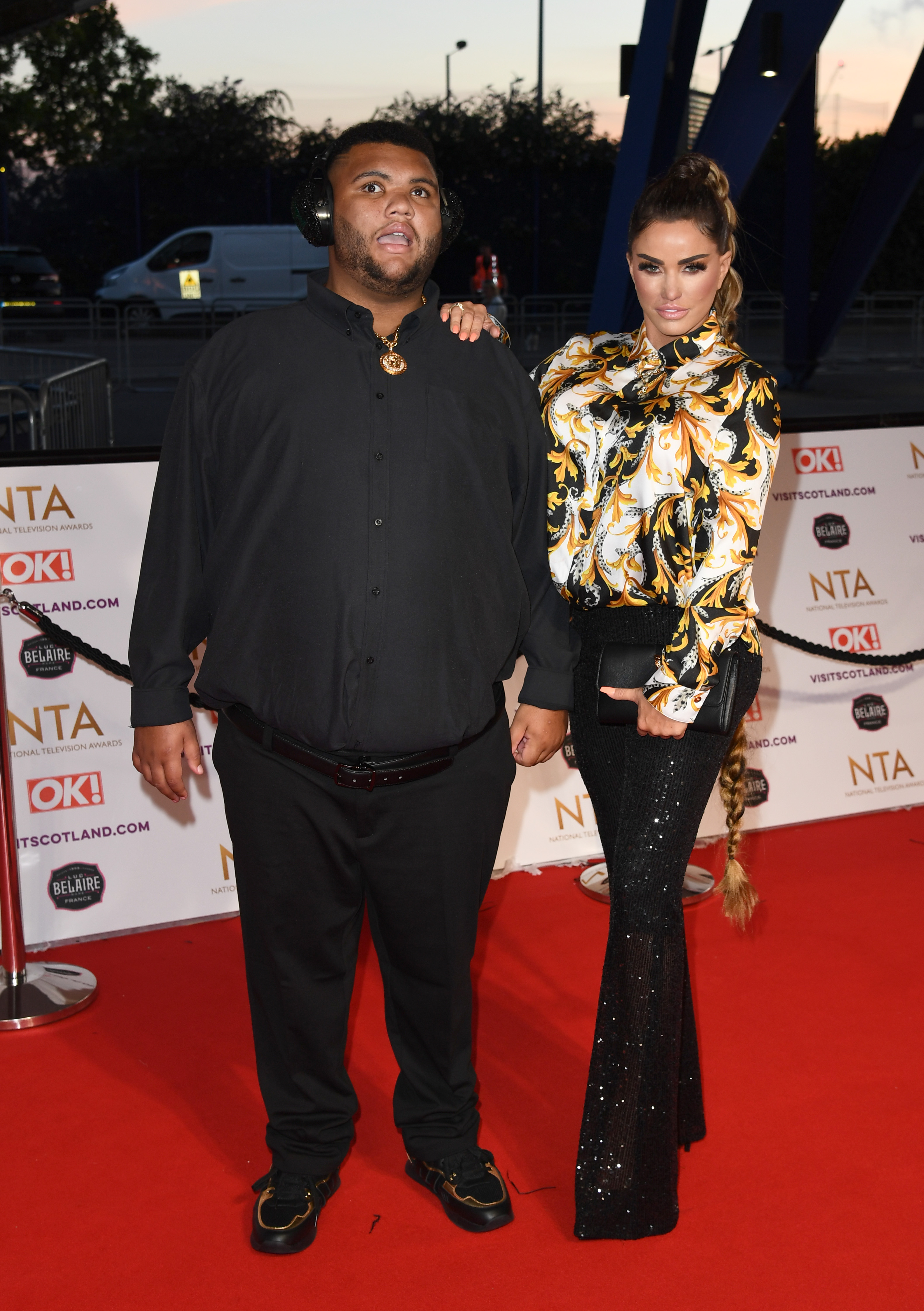 Harvey Price joins his mother, Katie Price, on the red carpet at the National Television Awards in London on September 9, 2021. Wearing protective earmuffs and a gold medallion, Harvey stood proudly beside Katie, who dazzled in a patterned silk blouse and sequinned flares. Their appearance came during a period of increased public support for Katie's campaign against online abuse.