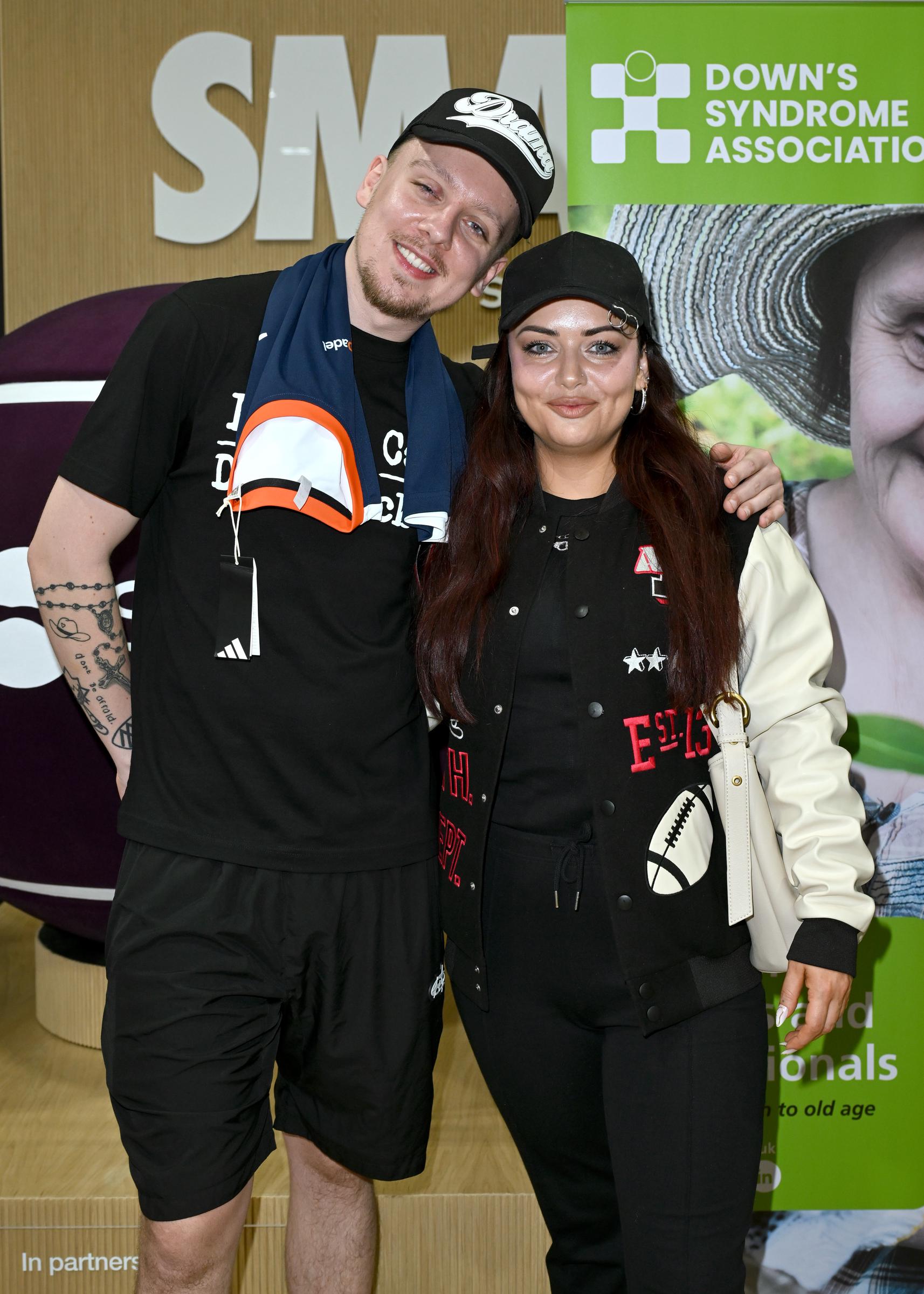 Aitch and Shona McGarty pose during a Padel Party Event For World Down's Syndrome Day hosted by Aitch on 21 March 2026 in Altrincham, England. | Source: Getty Images