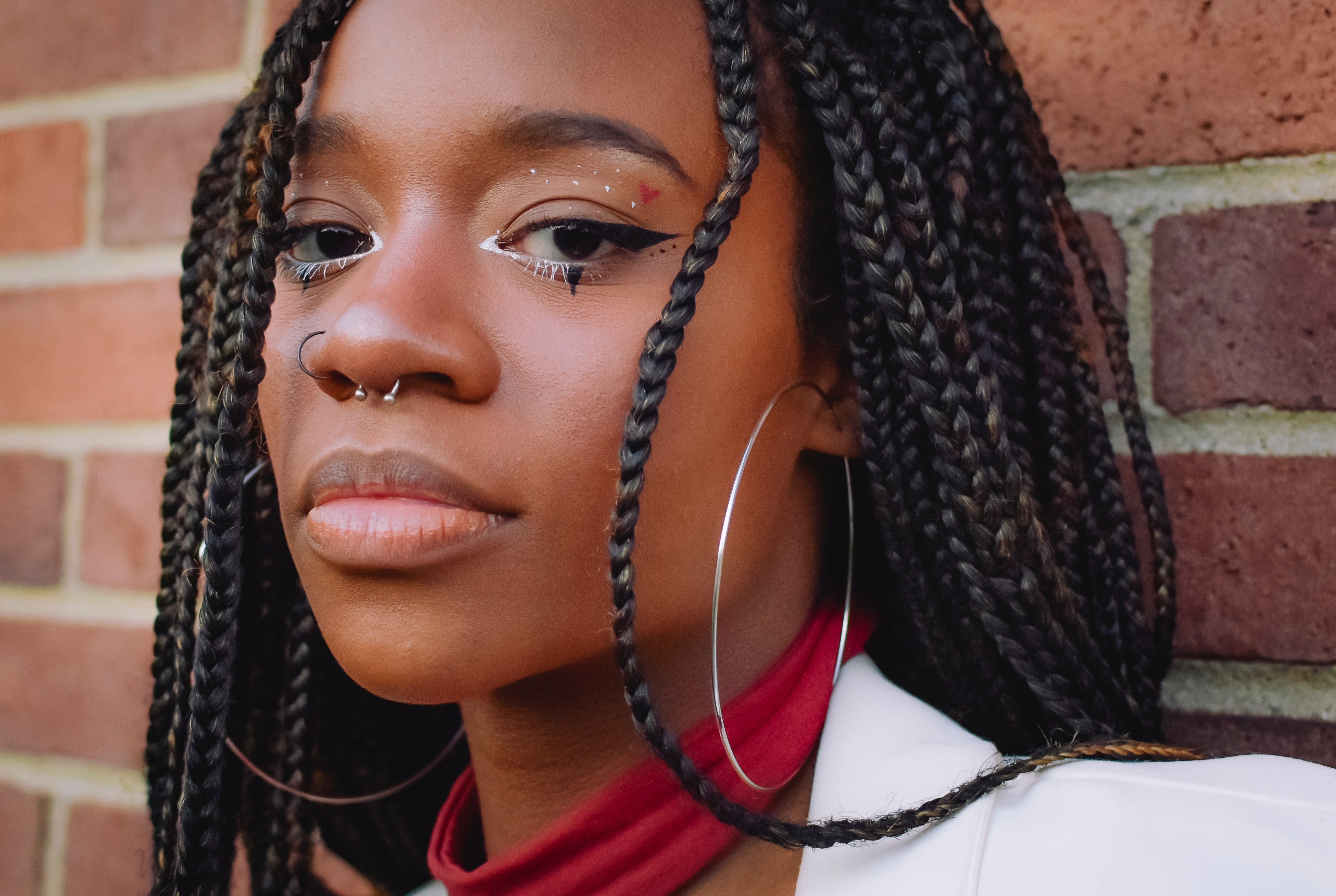 A woman with septum piercing ring | Source: Pexels