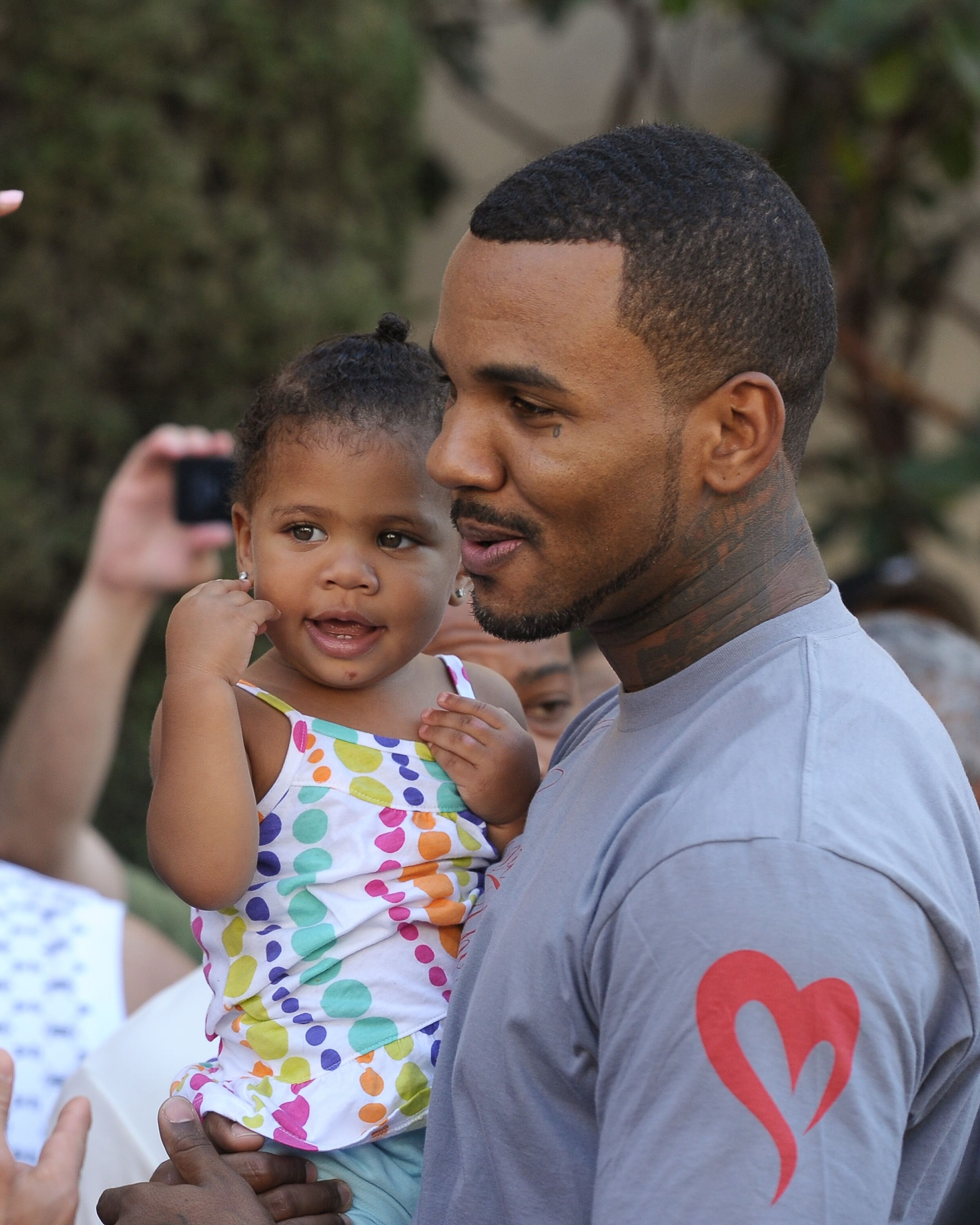 Rapper The Game with his youngest daughter California Dream/ Source: Getty Images