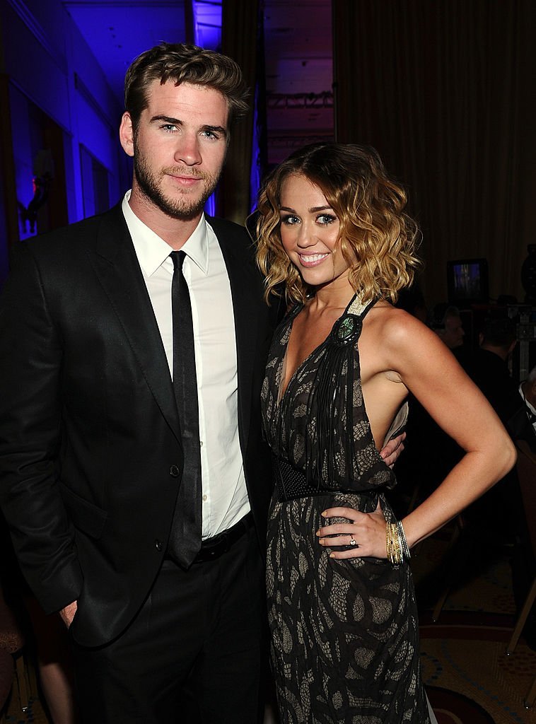 Miley Cyrus and Liam Hemsworth backstage during Muhammad Ali's Celebrity Fight Night XVIII held at JW Marriott Desert Ridge Resort & Spa on March 24, 2012, in Phoenix, Arizona. | Source: Getty Images.