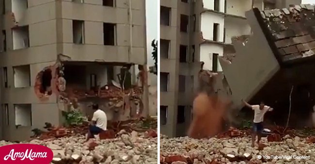 Man barely escapes with his life as building collapses on top of him (video)