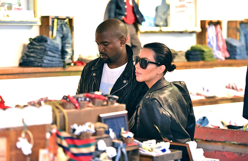 Kanye West and Kim Kardashian visit children's clothing store Trico Field on June 1, 2015. | Photo: Getty Images