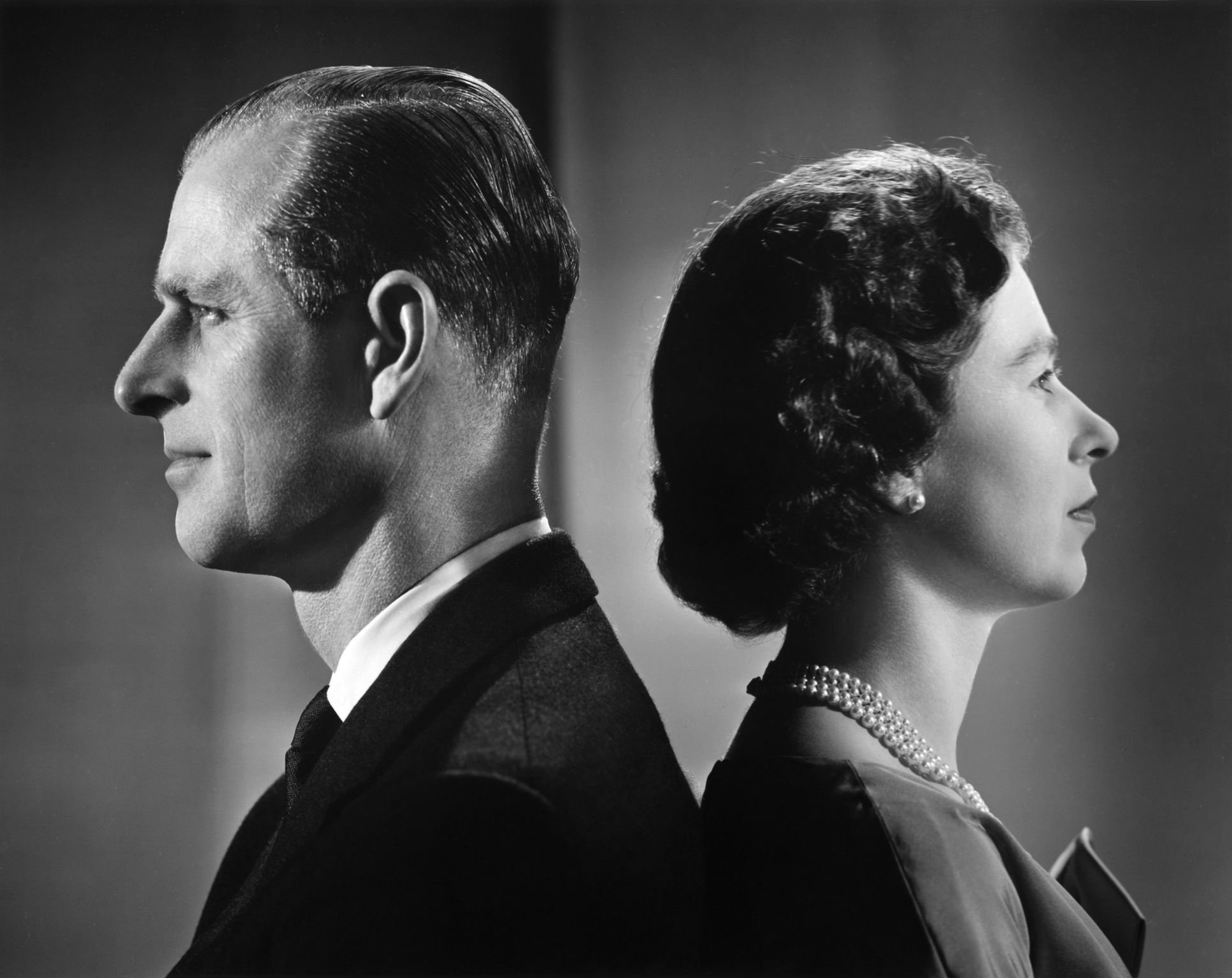 Queen Elizabeth II and Prince Philip pose for a portrait at home in Buckingham Palace in 1958 in London, England | Source: Getty Images