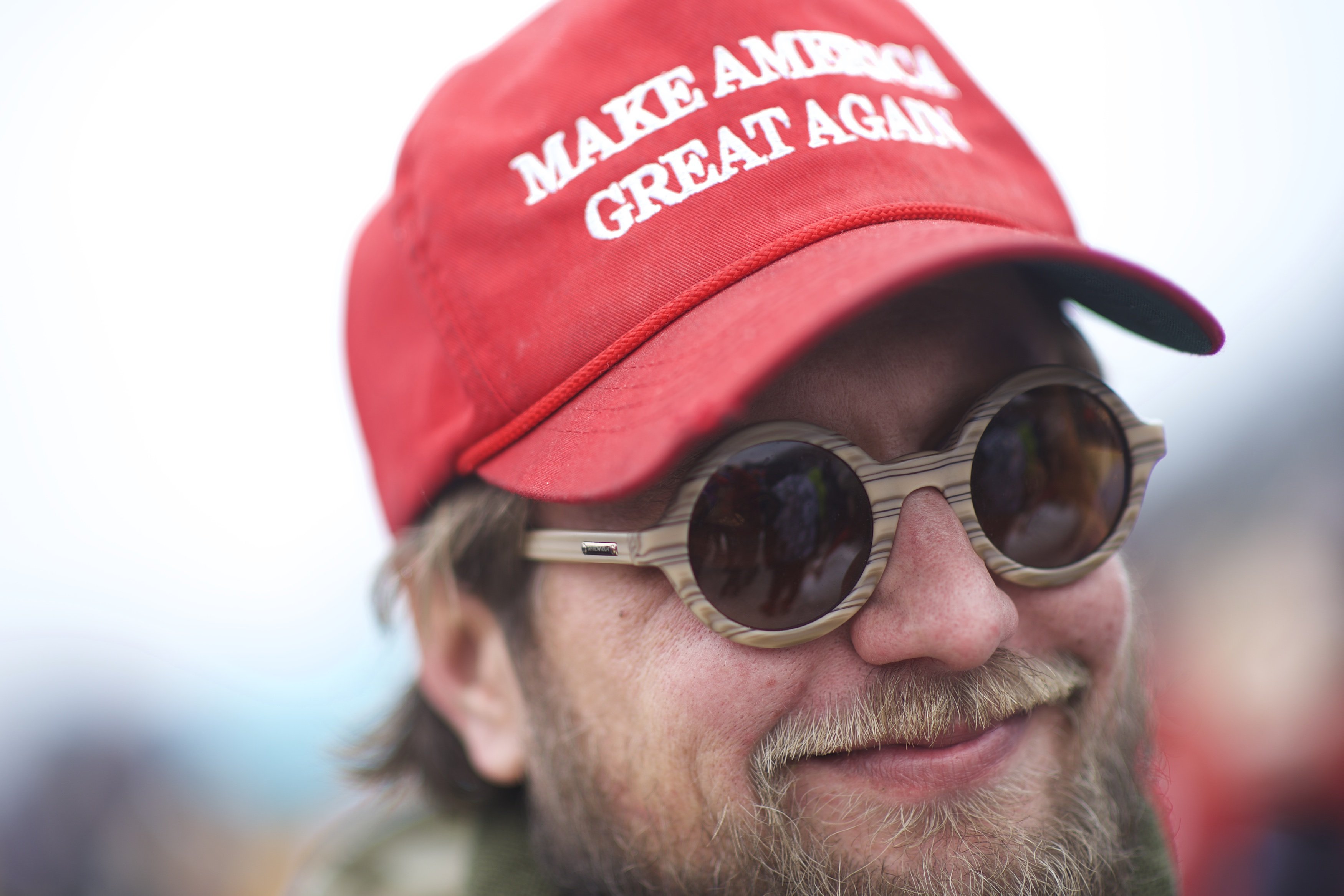 Man wearing a MAGA hat | Photo: Getty Images