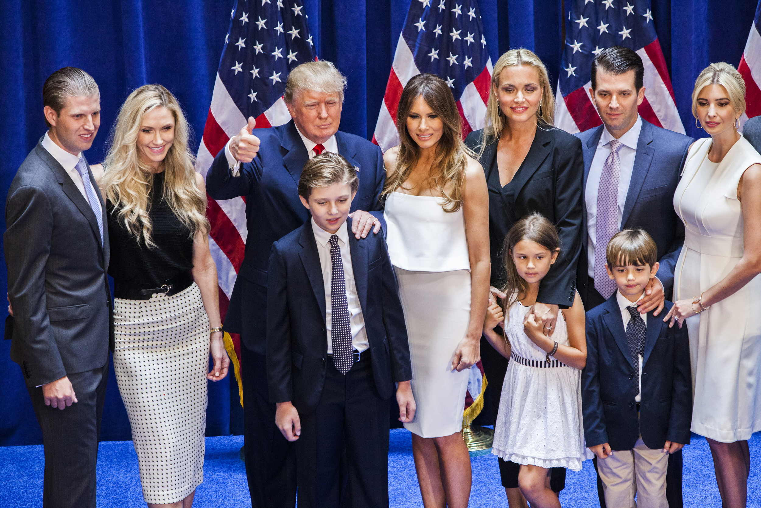 Eric Trump, Lara Yunaska Trump, Donald Trump, Barron Trump, Melania Trump, Vanessa Haydon Trump, Kai Madison Trump, Donald Trump Jr., Donald John Trump III, and Ivanka Trump pose for photos on stage after Donald Trump announced his candidacy for the U.S. presidency at Trump Tower on June 16, 2015 in New York City | Source: Getty Images