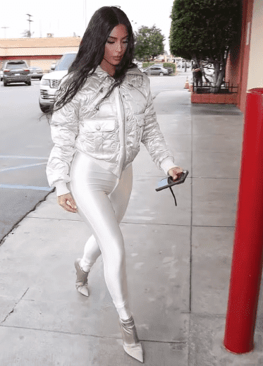 Kim Kardashian wearing Shiny White Leggings and Puffer Jacket While in Calabasas.| Photo: YouTube/ Celebrity News.