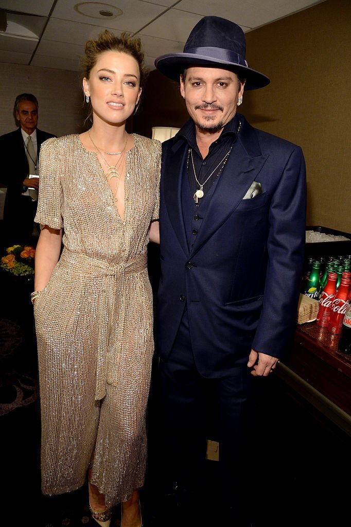 Amber Heard (L) and Johnny Depp attend the 19th Annual Hollywood Film Awards at The Beverly Hilton Hotel on November 1, 2015 in Beverly Hills, California. | Photo: Getty Images Amber Heard (L) and Johnny Depp attend the 19th Annual Hollywood Film Awards at The Beverly Hilton Hotel on November 1, 2015 in Beverly Hills, California. | Photo: Getty Images