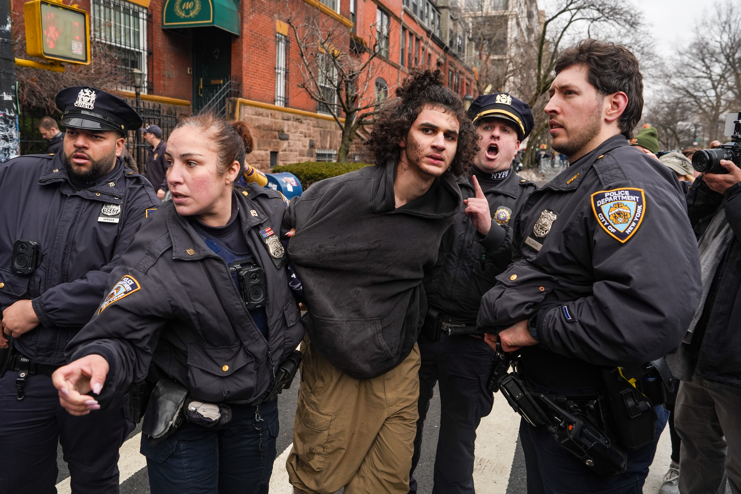 One of the suspects getting arrested after the incident outside Zohran Mamdani's residence. | Source: Getty Images