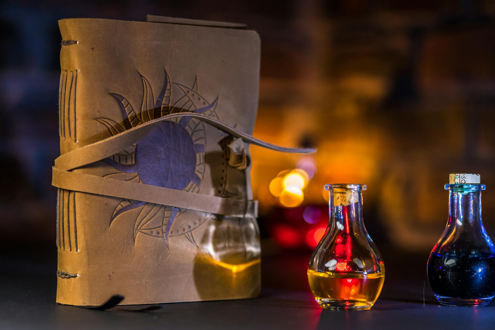 A closeup of a spell book placed beside potions | Source: Pexels