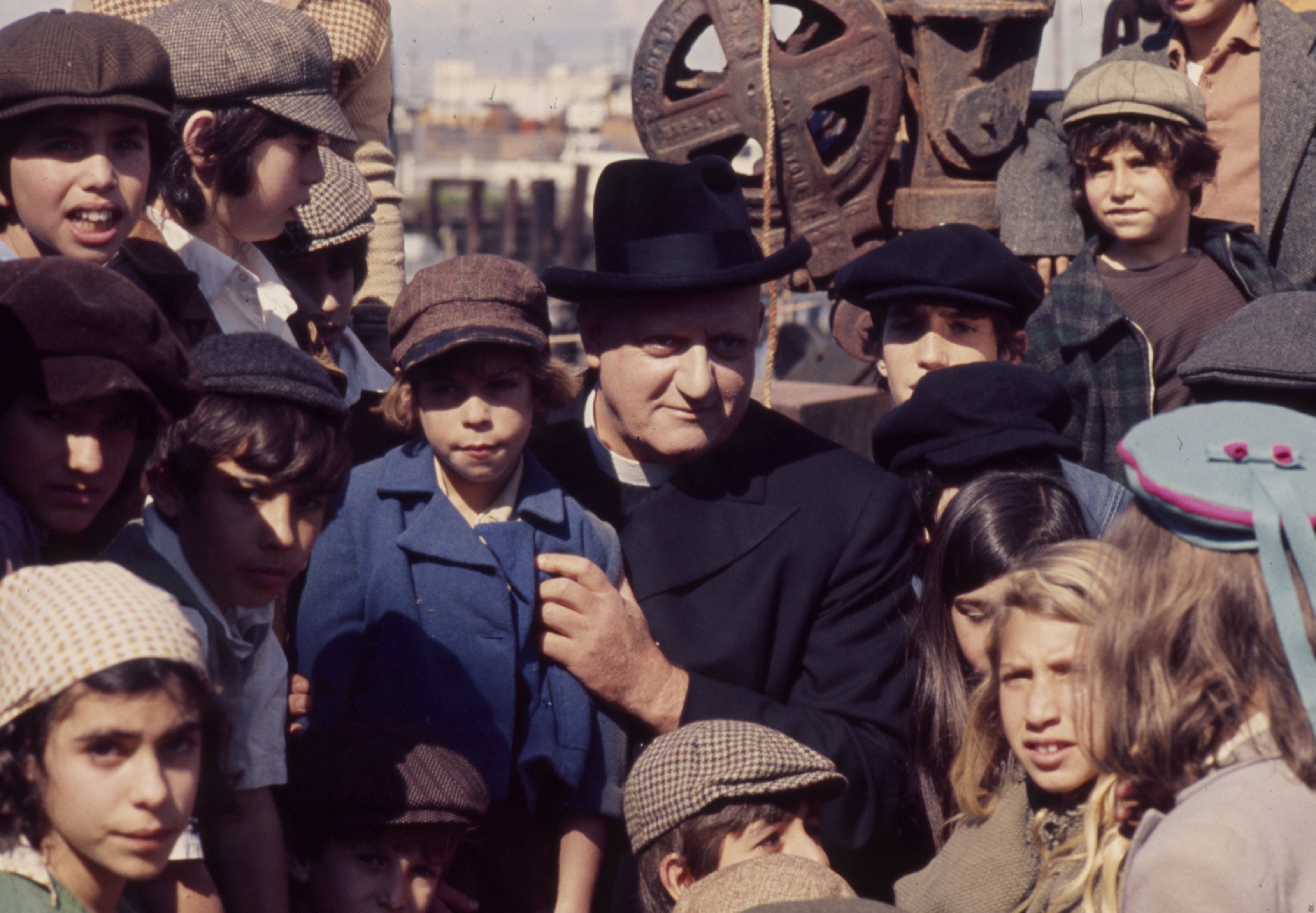 Raymond Burr pictured with extras in the TV movie "Portrait: A Man Whose Name Was John" on April 22, 1973 ┃Source: Getty Images