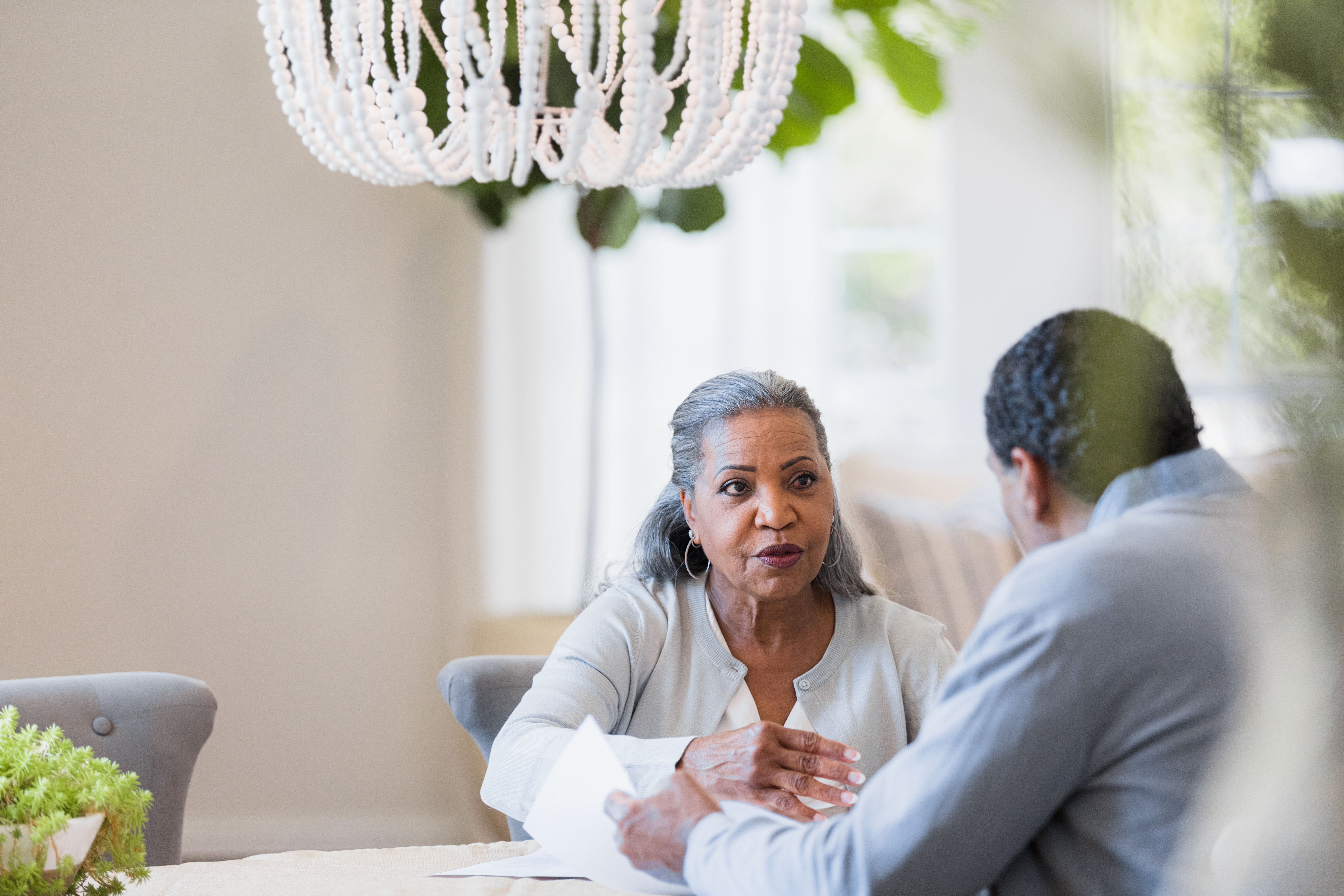 Senior couple has serious discussion about home finances | Source: Getty Images