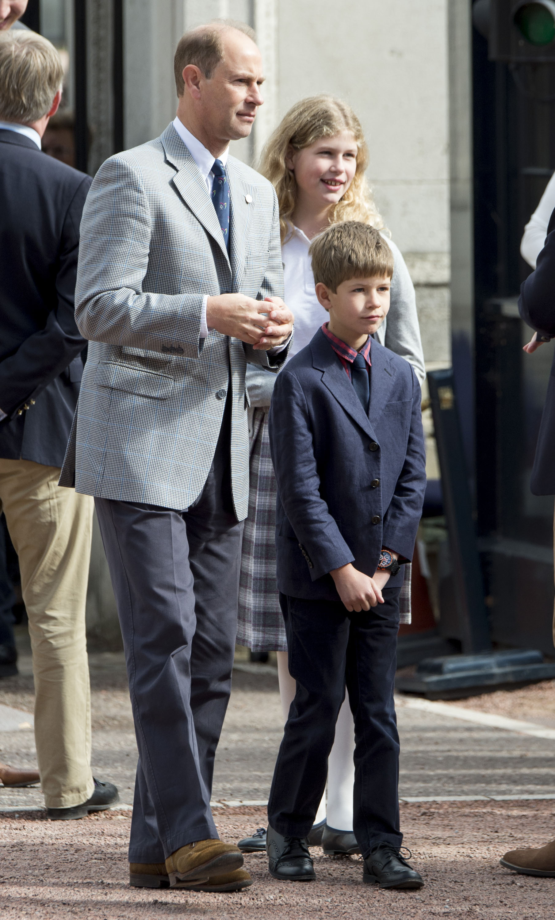 Together in support: The Wessex children wait outside Buckingham Palace on 25 September 2016 as their mother, Sophie, arrives after completing a grueling charity bike ride from Edinburgh. Prince Edward, Lady Louise, and James gathered proudly to celebrate her achievement.