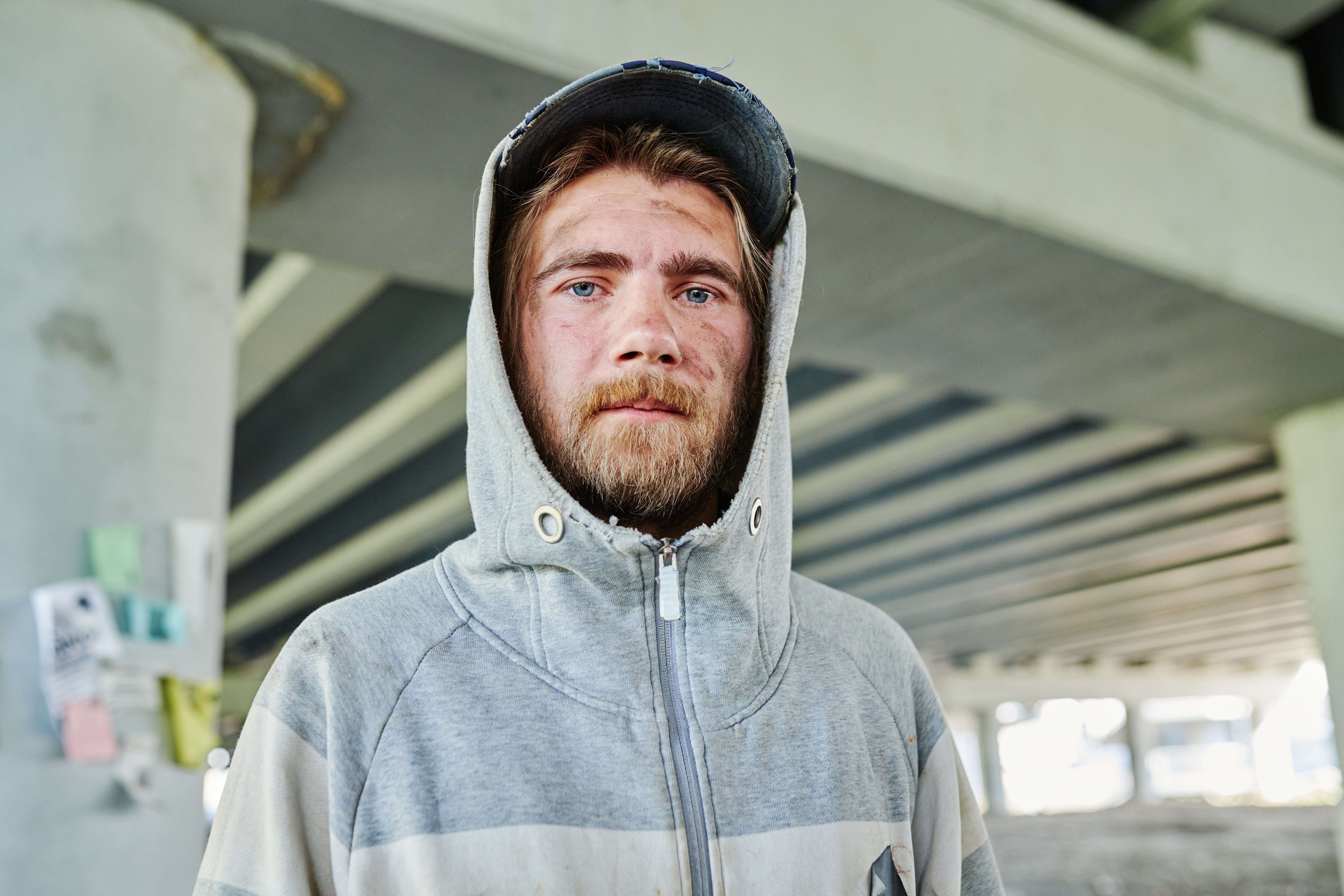 Poor homeless young man outdoors | Source: Shutterstock