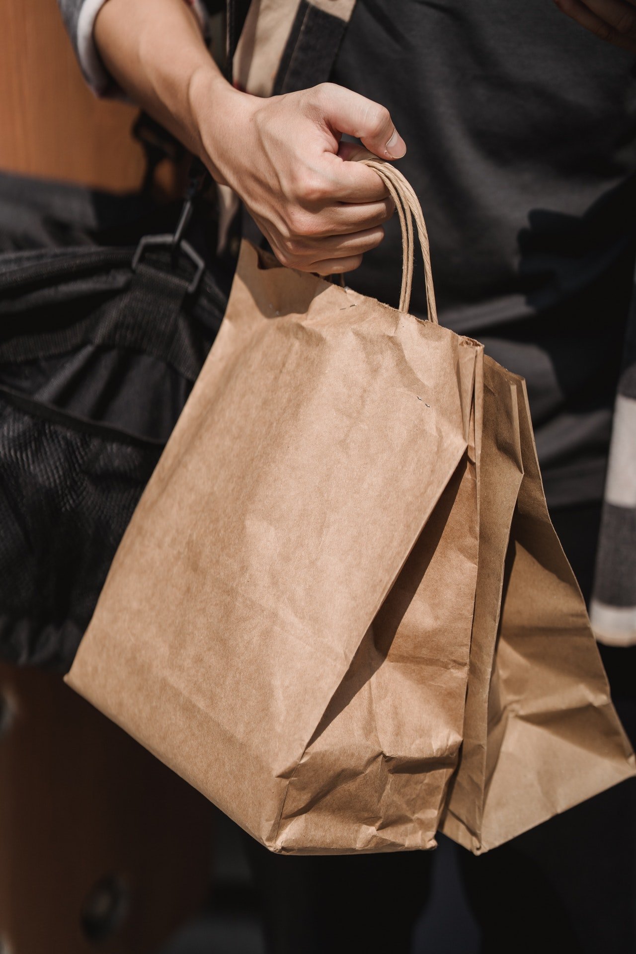 Before the man could dissuade Robert, he was already walking away with both bags of goods, his included | Source: Pexels