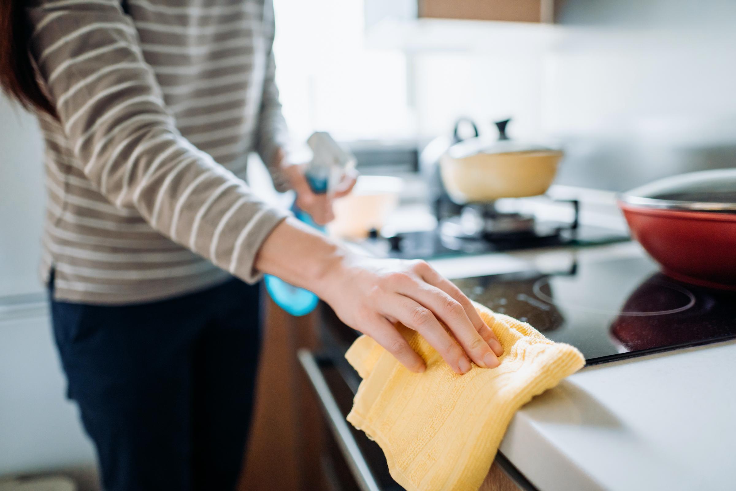 A woman cleaning her kitchen counter | Source: Getty Images
