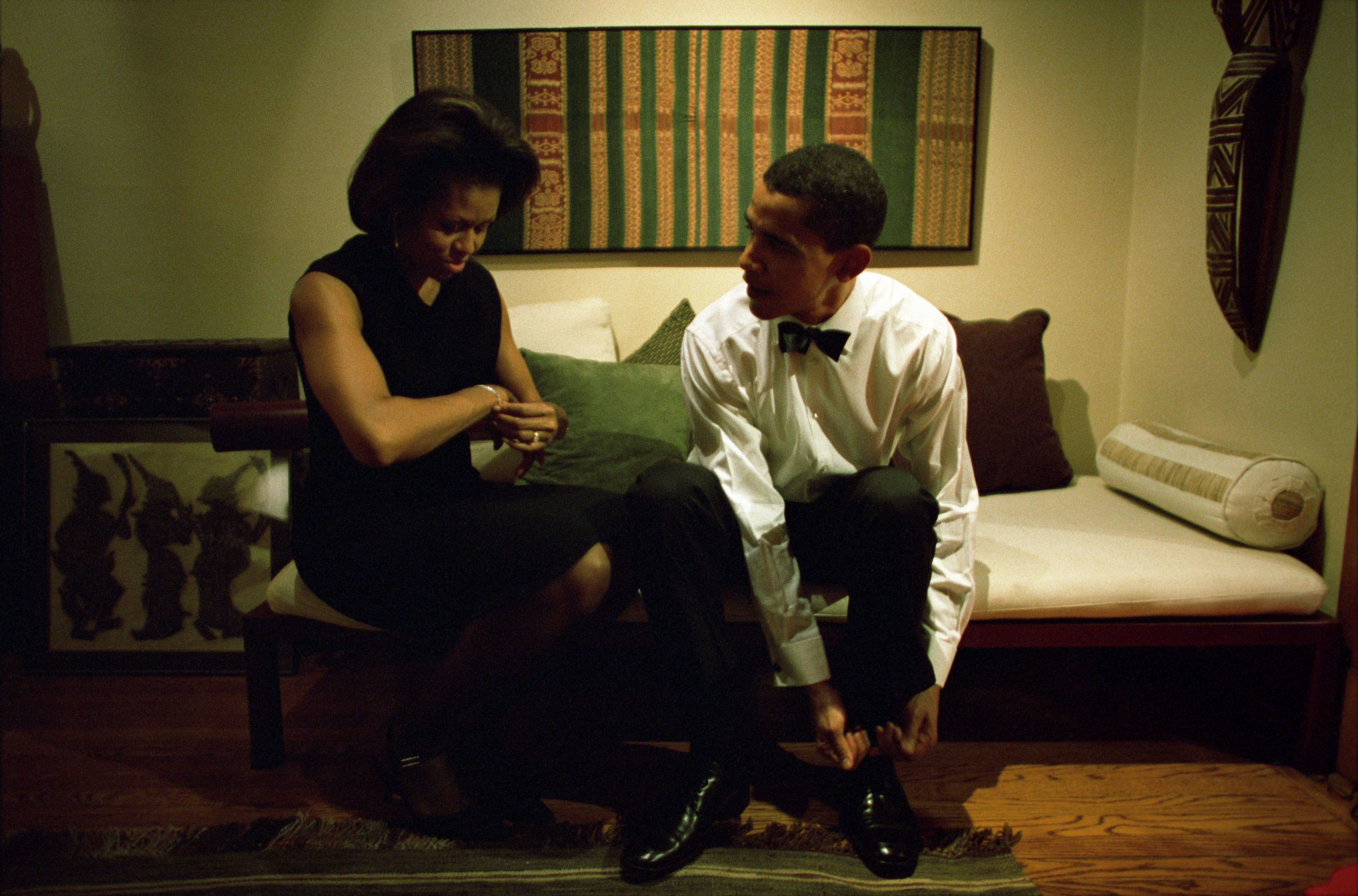 Michelle and Barack Obama photographed getting ready at their home on December 8, 2004, in Chicago, Illinois. | Source: Getty Images