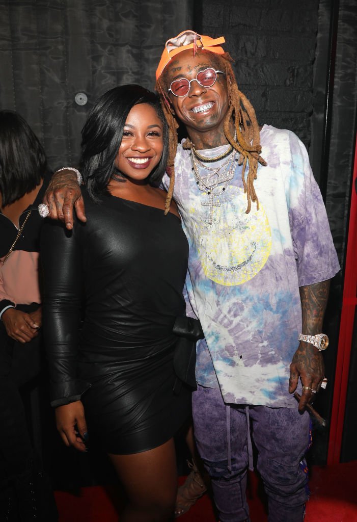 Reginae Carter and her father, Lil Wayne at the rapper's 36th birthday party. | Photo: Getty Images