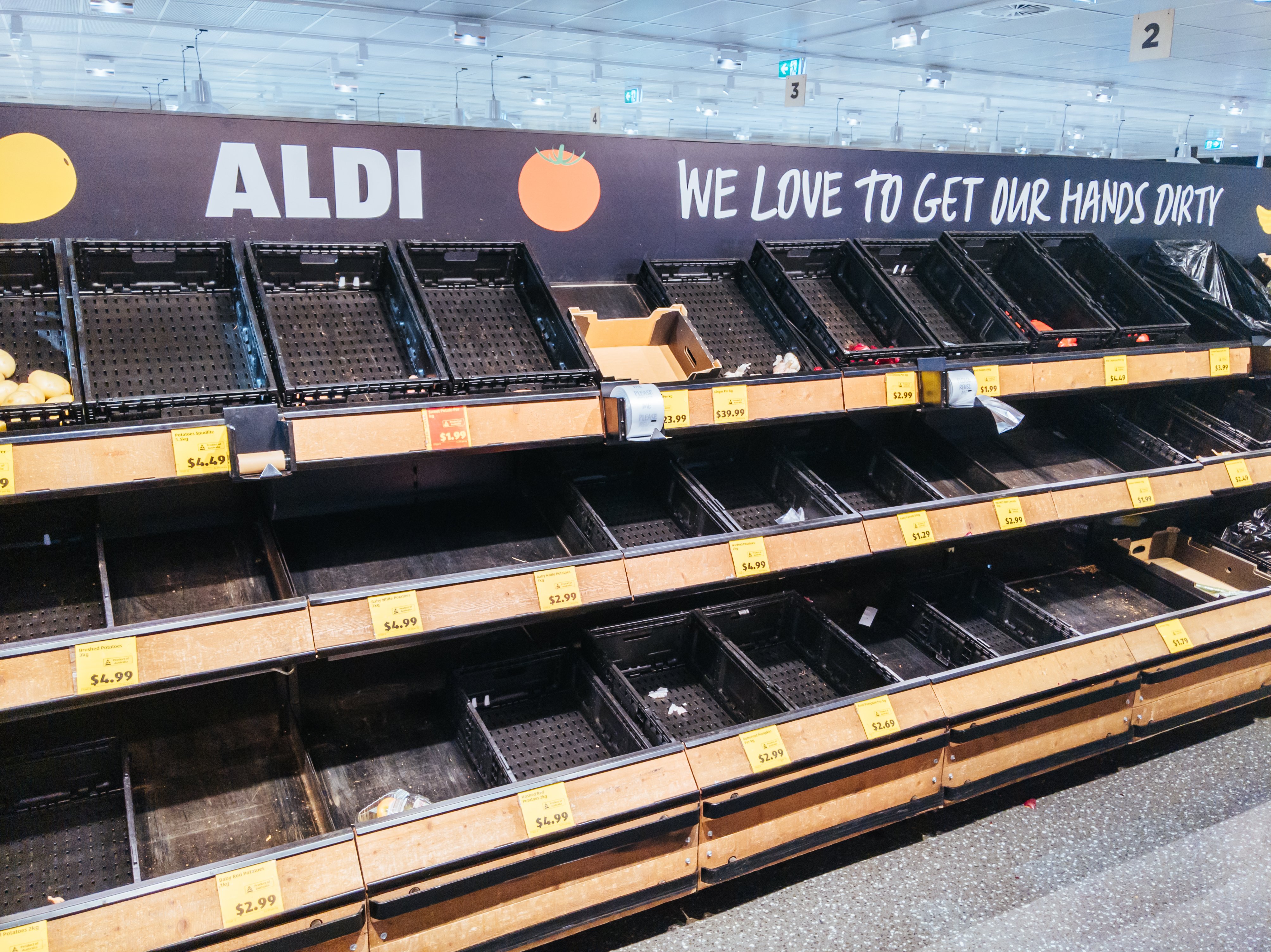 Empty shelves became a view across many Aldi Supermarkets throughout the pandemic. | Photo: Getty Images.