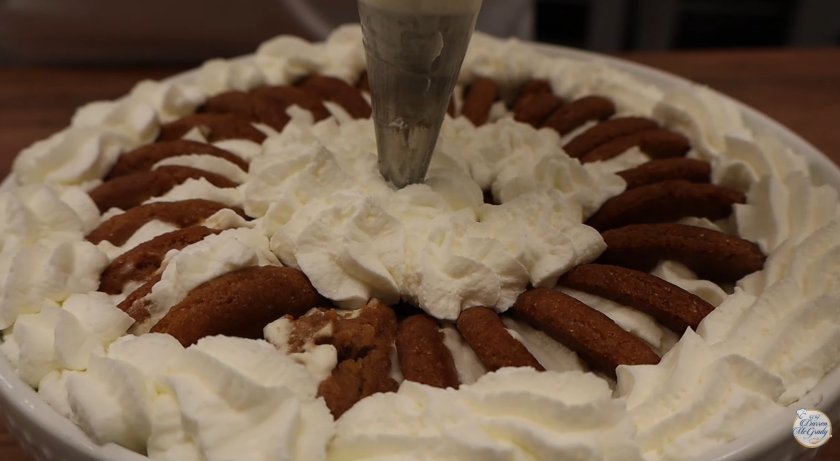 The finished dessert was topped with piped whipped cream, creating a decorative and indulgent final layer fit for the royal table. | Source: YouTube/Darren McGrady