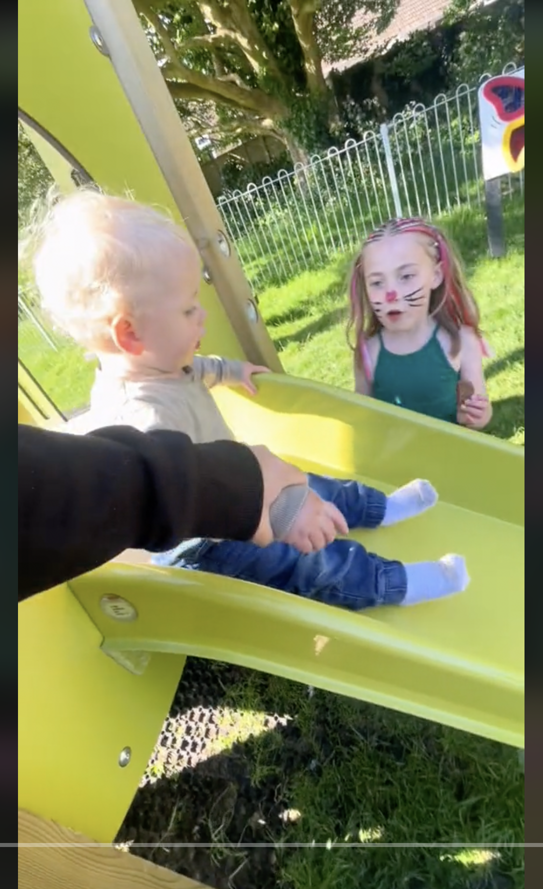 Nicole Austin's children playing on a slide, as seen in a clip dated June 1, 2024 | Source: TikTok/@theaustins_1