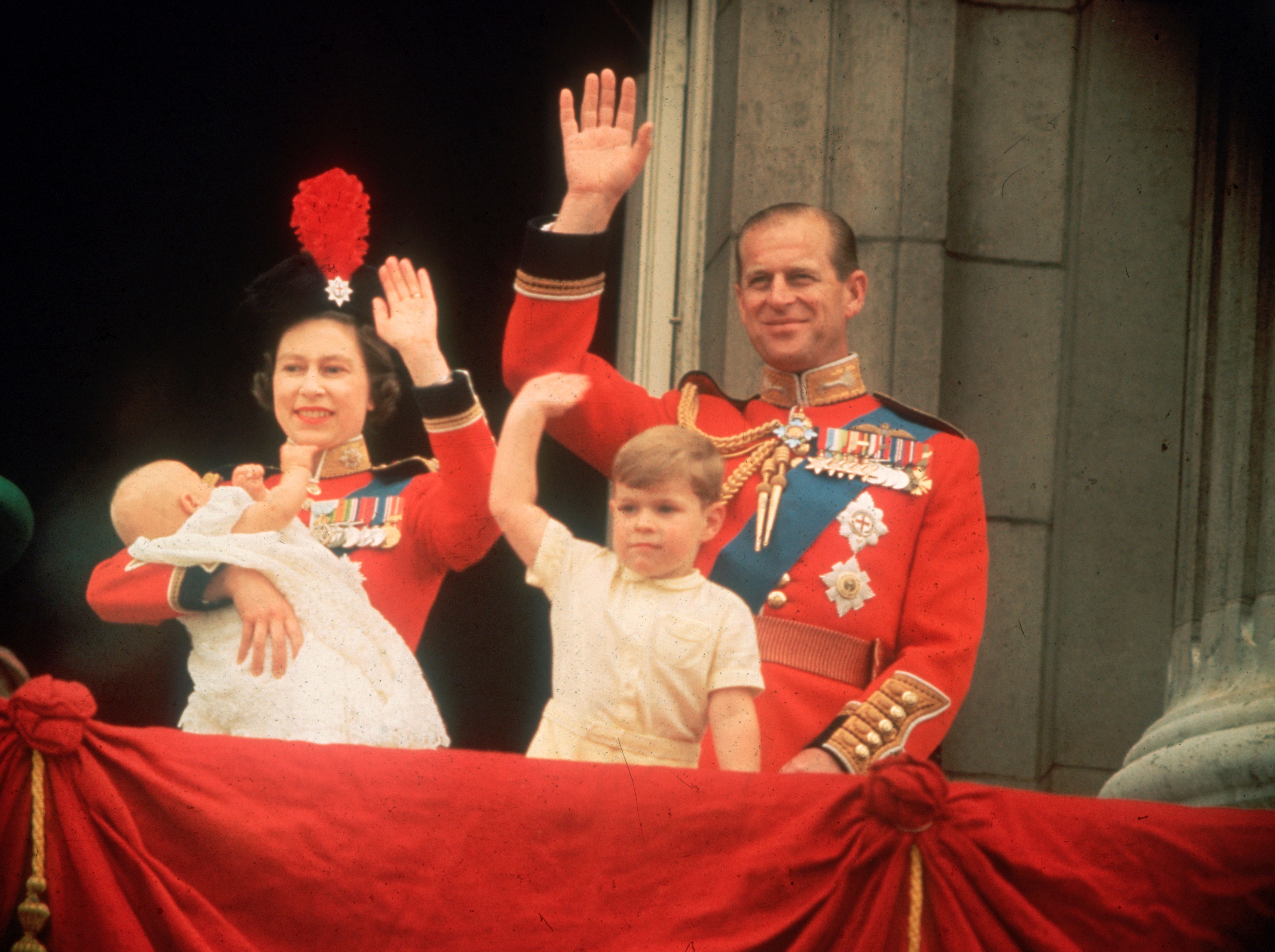 Queen Elizabeth, Prince Philip, Prince Andrew, and Prince Edward on the balcony at Buckingham Palace during the Trooping of the Colour event on June 13, 1964. | Source: Fox Photos/Getty Images