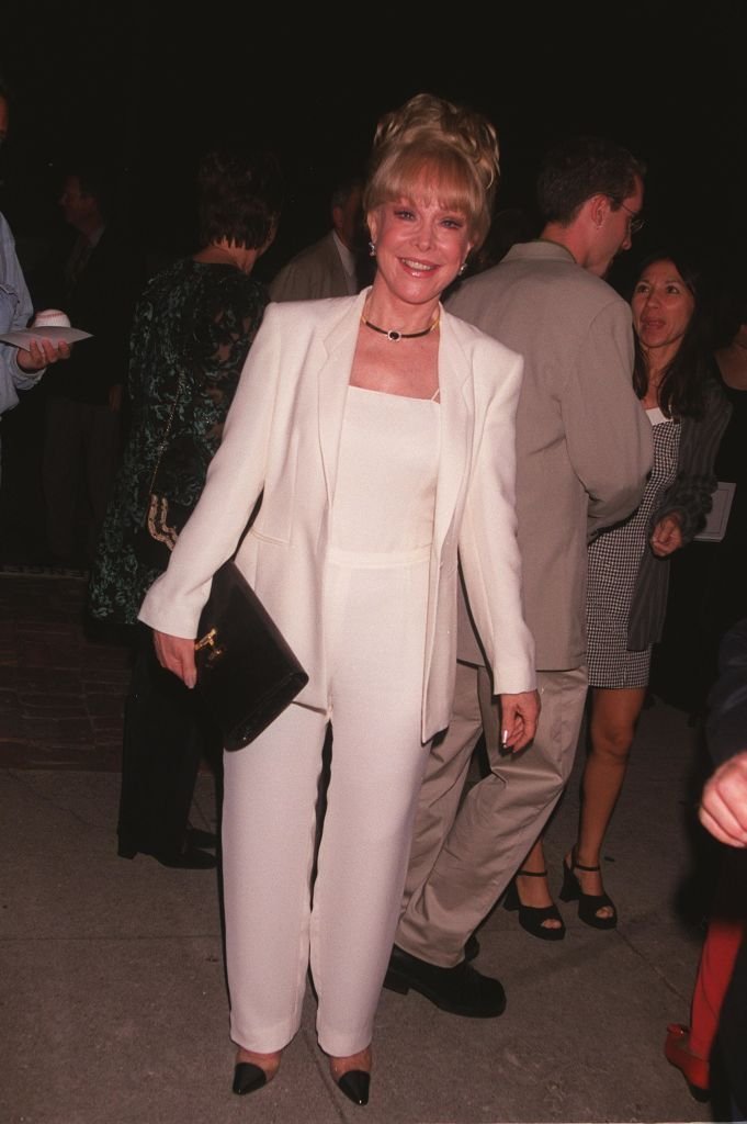 Barbara Eden poses for photographers at Nanette Fabray's 80th birthday celebration at Spencer's Restaurant | Getty Images