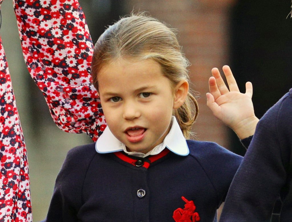 Princess Charlotte waves upon arrival for her first day of school at Thomas' Battersea in London on September 5, 2019 | Photo: Getty Images