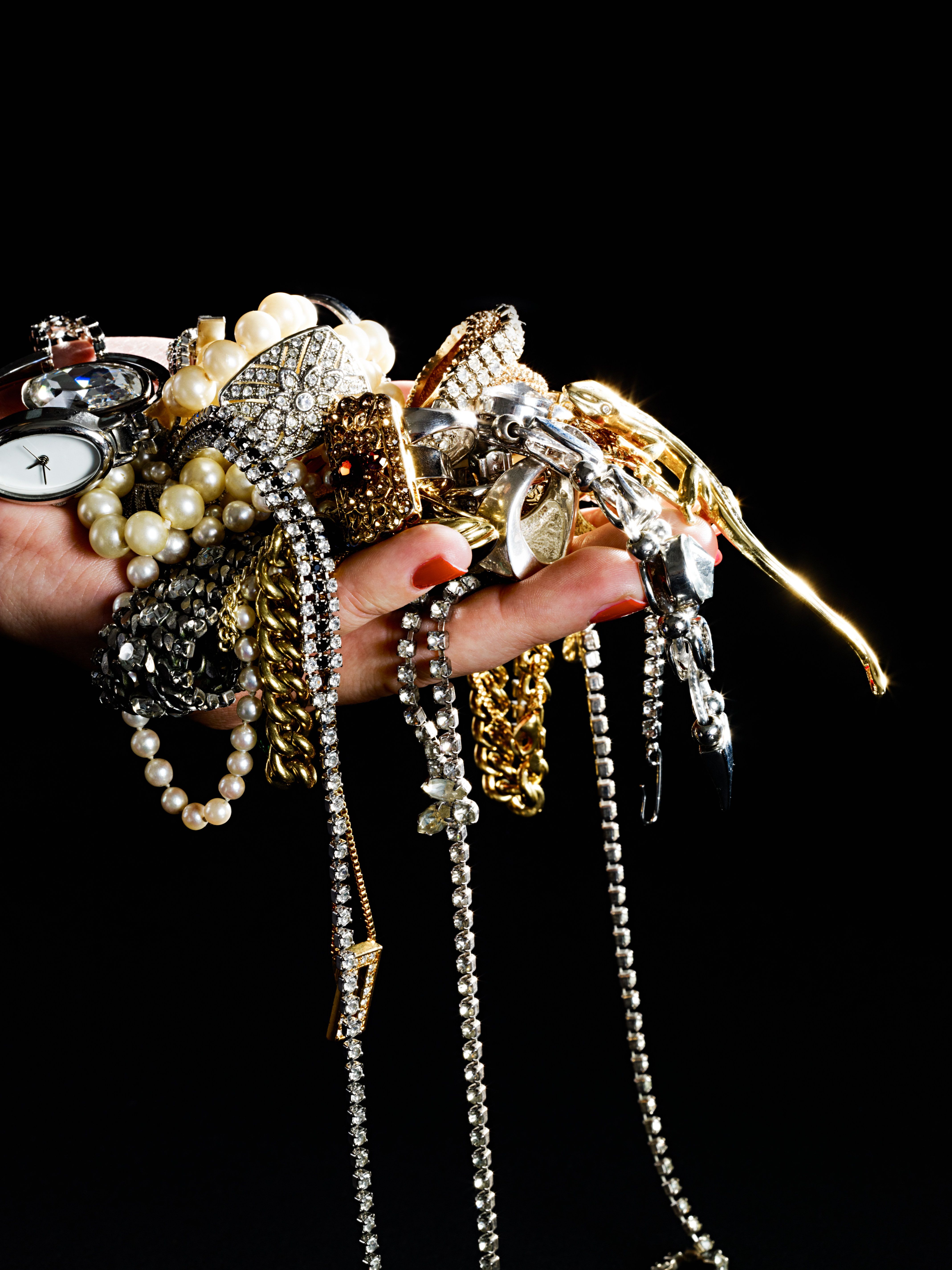 A woman holding jewelry. | Source: Getty Images