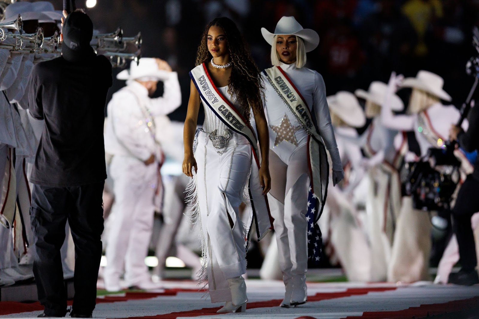 Blue Ivy Carter walking onto the field for Beyoncé's halftime show during an NFL football game between the Baltimore Ravens and the Houston Texans, at NRG Stadium on December 25, 2024, in Houston, Texas. | Source: Getty Images