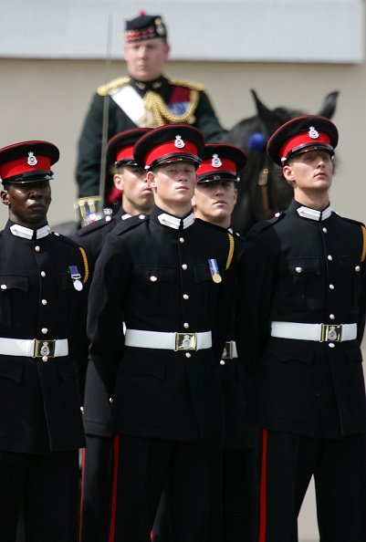 Prince Harry (C) takes part in the Trooping Of New Colours alongside his fellow officer cadets at the Royal Military Academy on June 21, 2005, in Sandhurst, England. | Source: Getty Images.