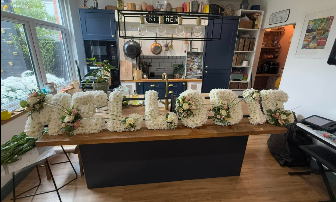 A flower arrangement spelling out the name Mellodie, dated March 3, 2025 | Source: Facebook/steven.darby.16