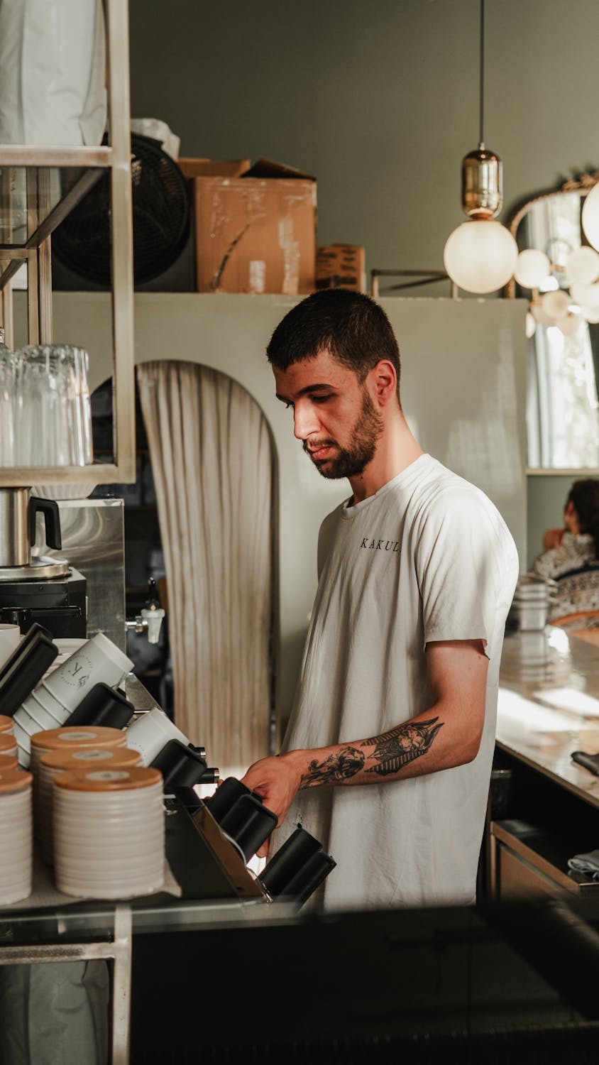 A man working in his cafe | Source: Pexels